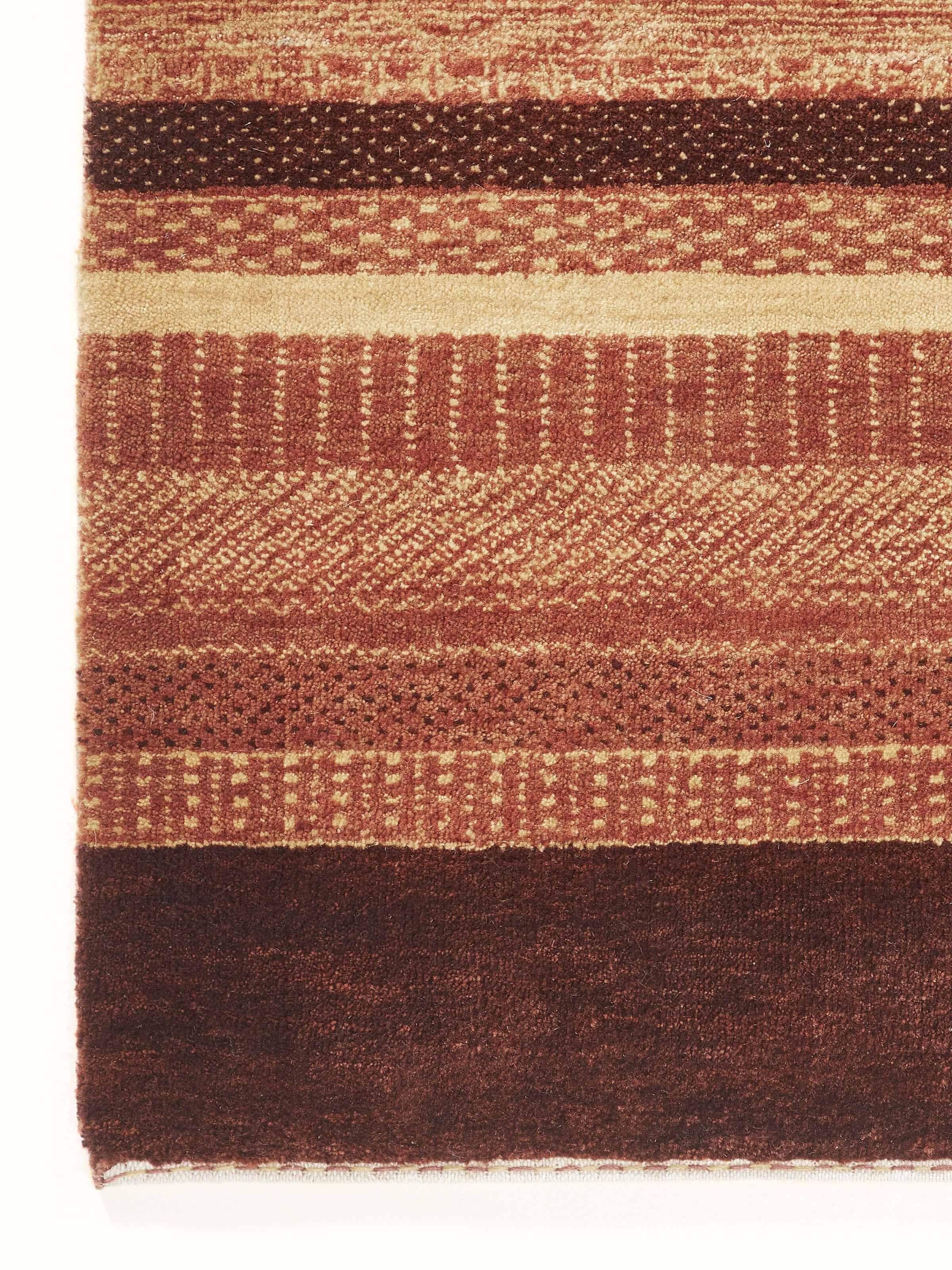 Detailed view of Traditional Gabbeh Rust Bhadohi Wool Hand-Knotted Rug highlighting the intricate weaving.