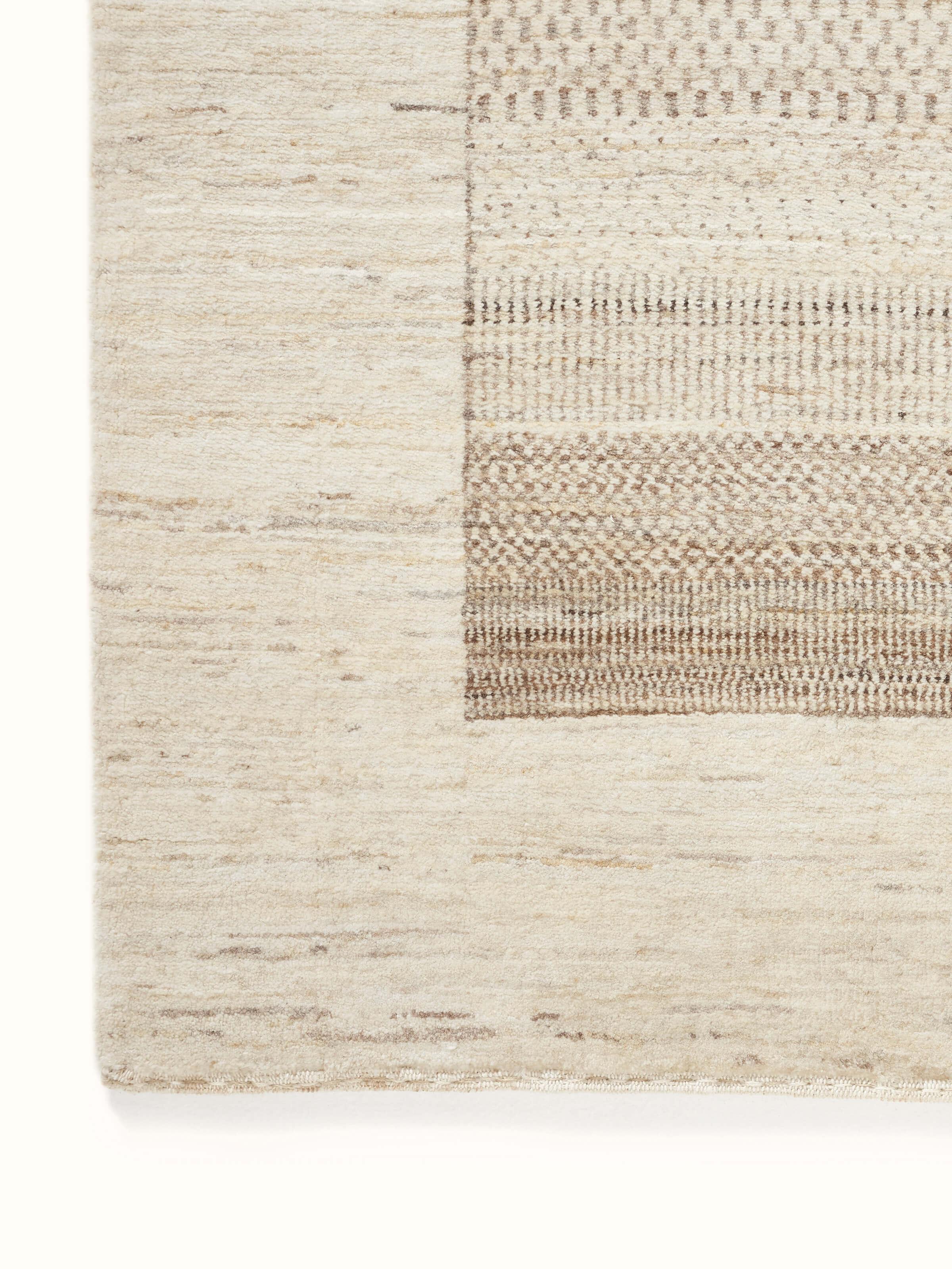 Side view of Traditional Gabbeh beige brown Bhadohi wool hand-knotted rug kharad capturing the thickness and craftsmanship