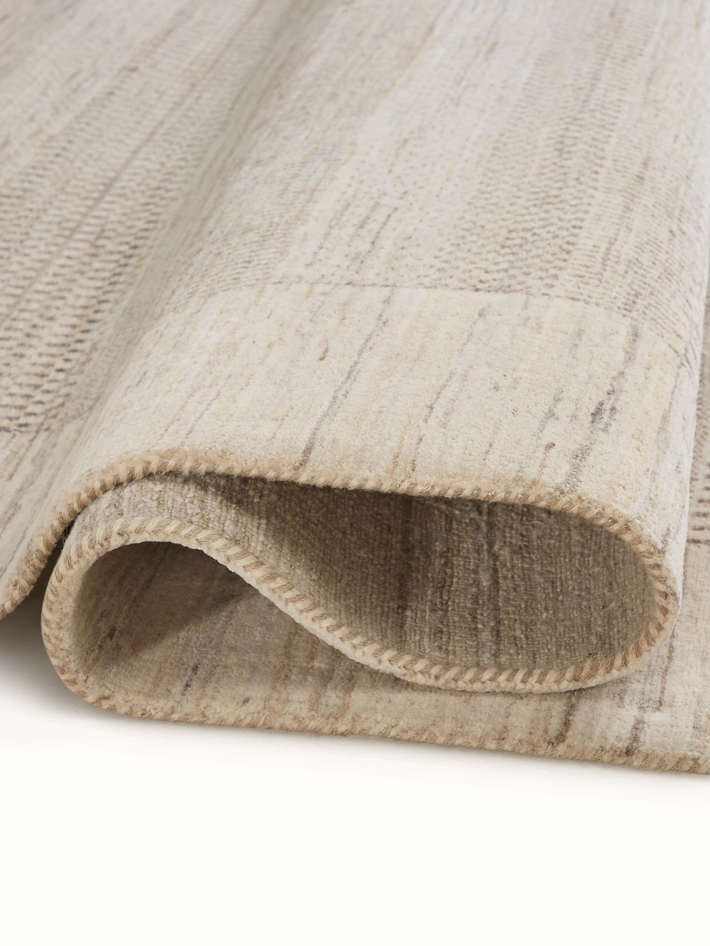 Detailed view of Traditional Gabbeh beige brown Bhadohi wool hand-knotted rug kharad focusing on the rich texture and design