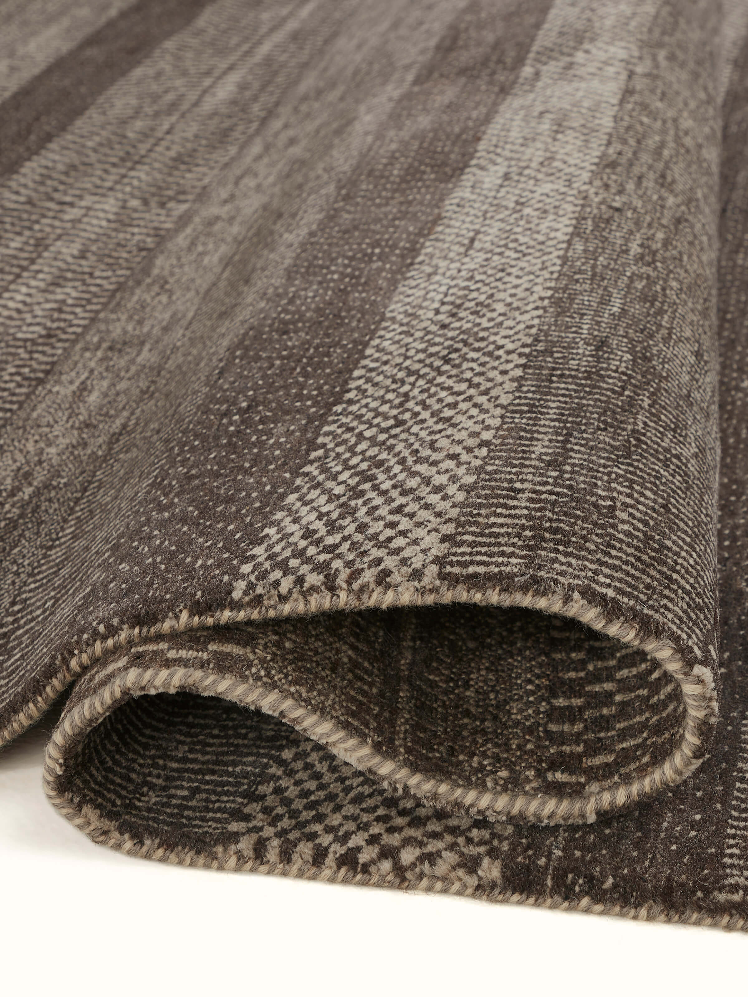 Detailed view of Traditional Gabbeh Grey Charcoal Bhadohi Wool Hand-Knotted Rug emphasizing the design and weave patterns.