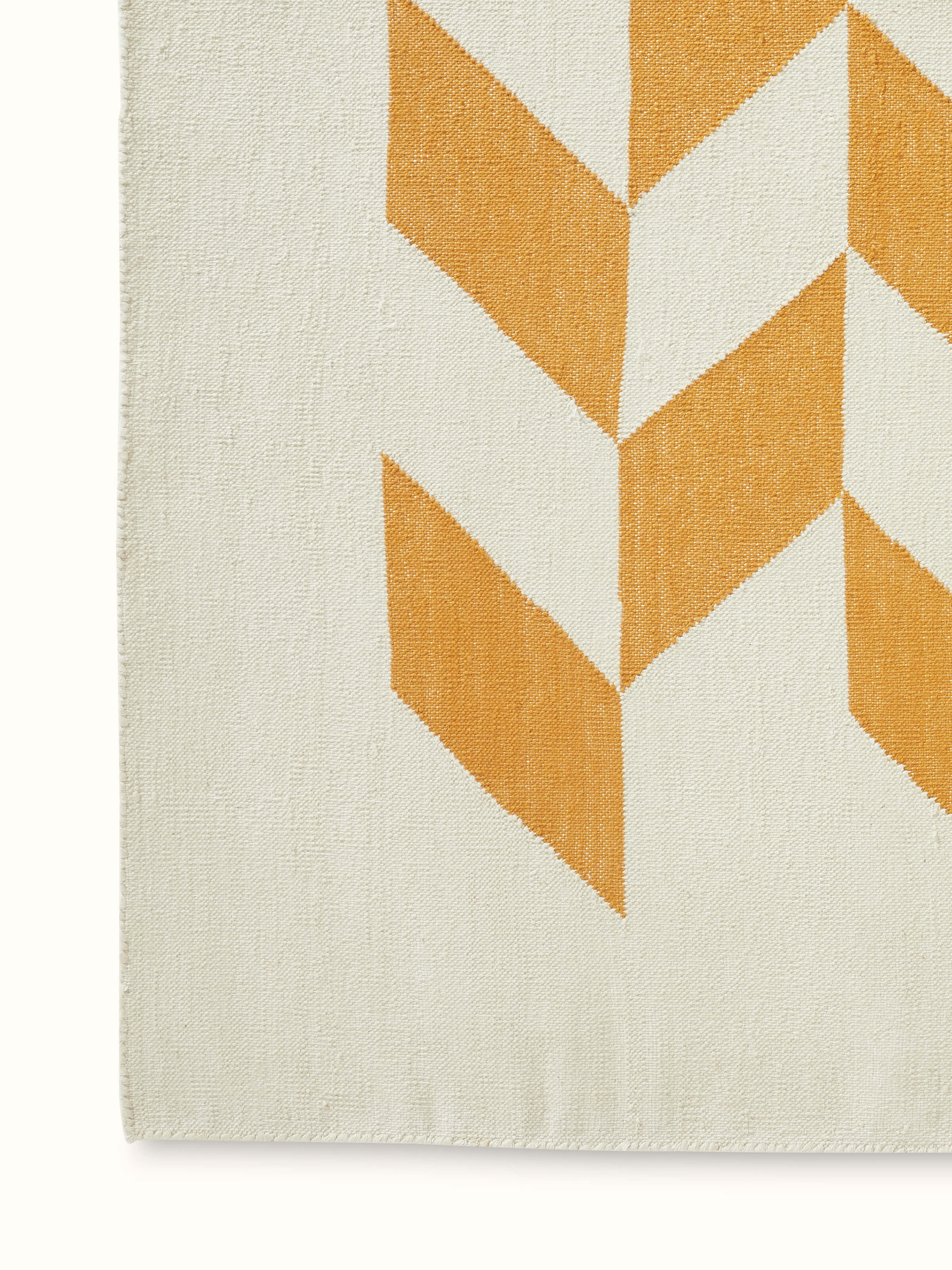 Close-up of the Modern Geo grey tan dhurrie highlighting its fine cotton texture