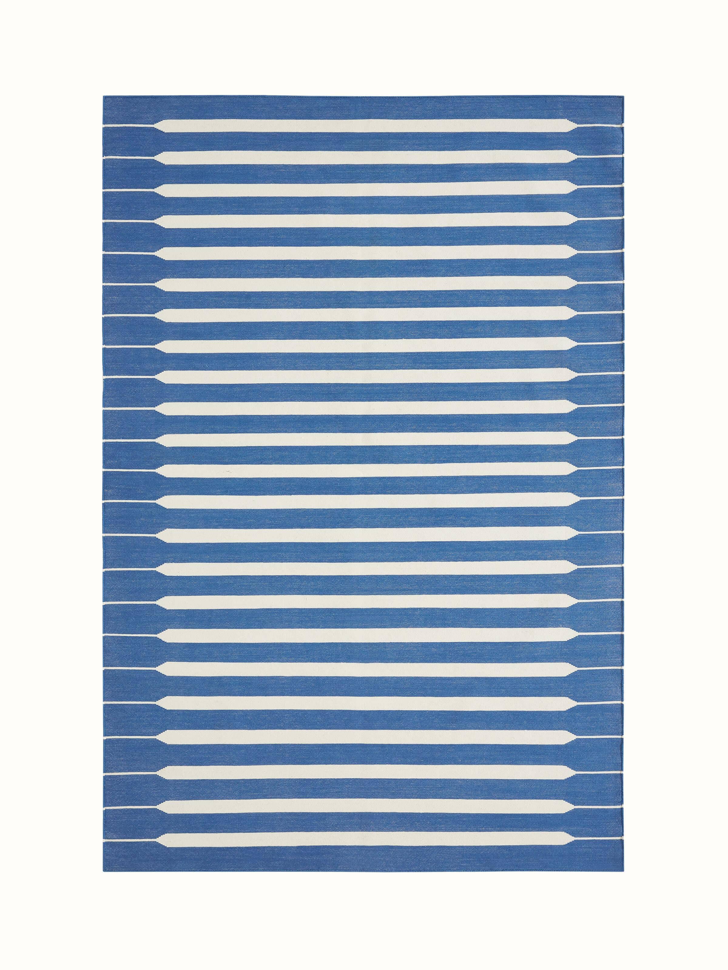 Top view of Modern geo stripe blue lawan cotton panja dhurrie showcasing its geometric stripe pattern and blue color.