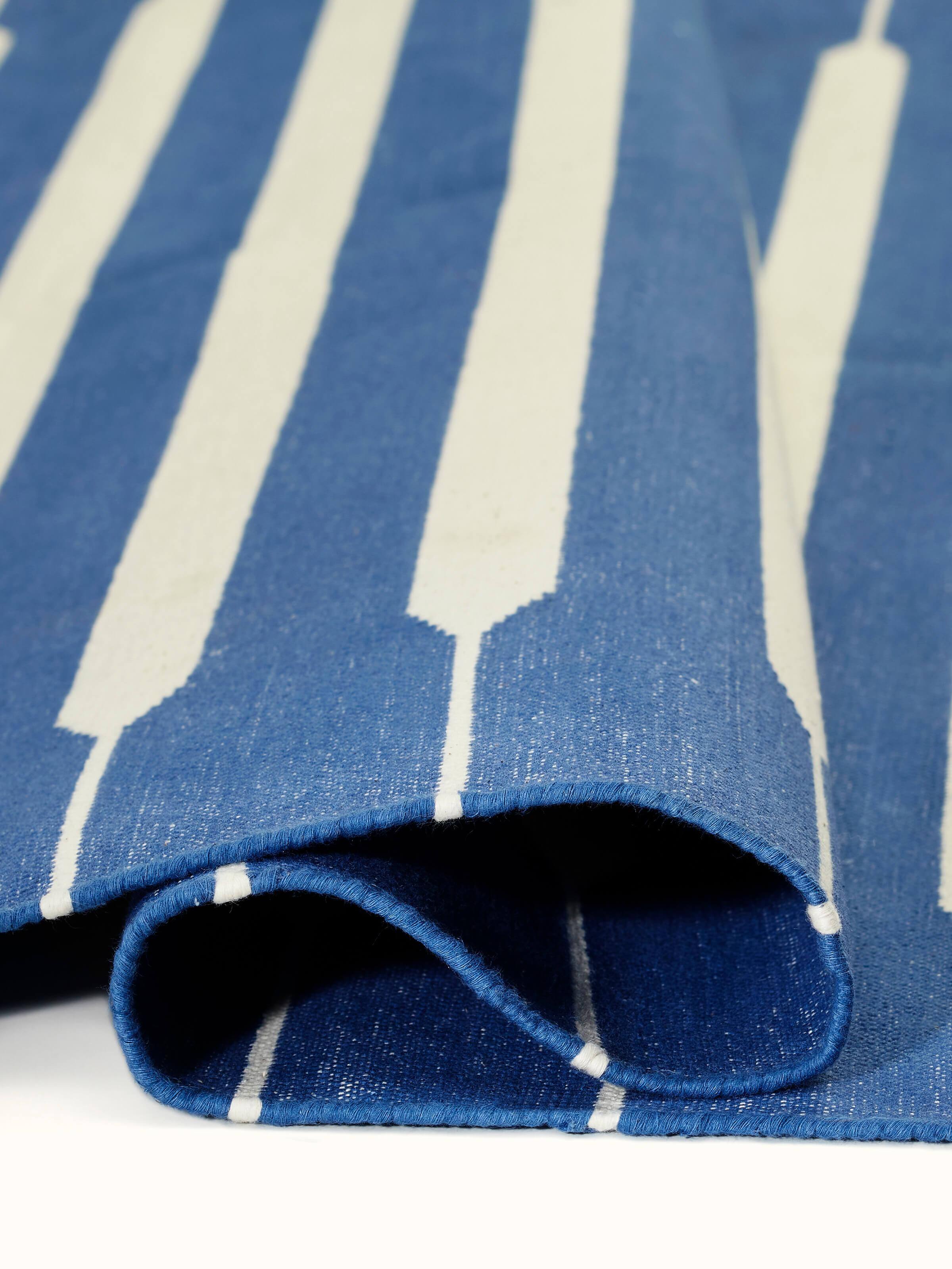 Full view of Modern geo stripe blue lawan cotton panja dhurrie showing the complete pattern and color distribution.