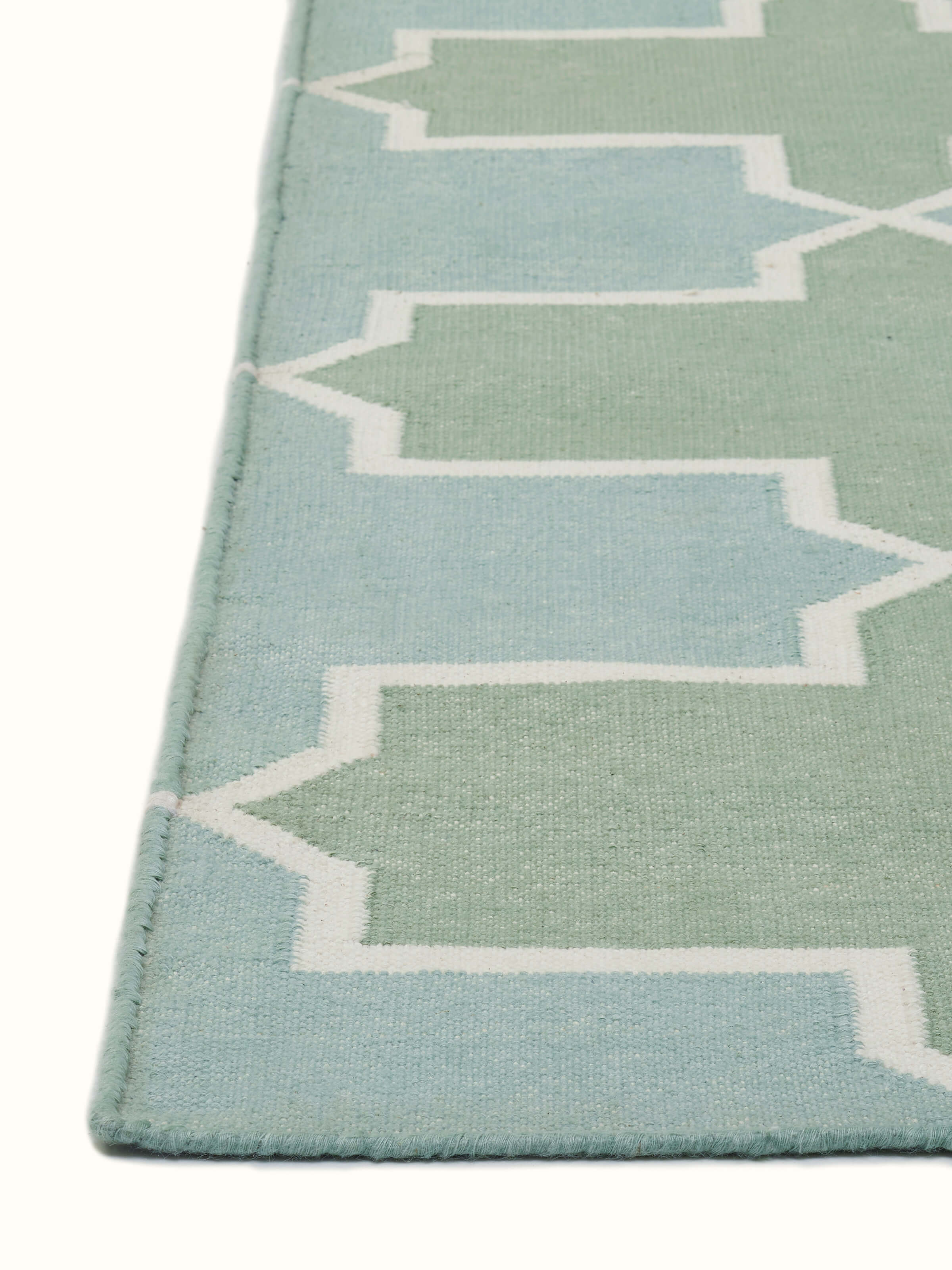 Top view of Modern Geo Green Lawan Cotton Panja Dhurrie featuring green geometric motifs