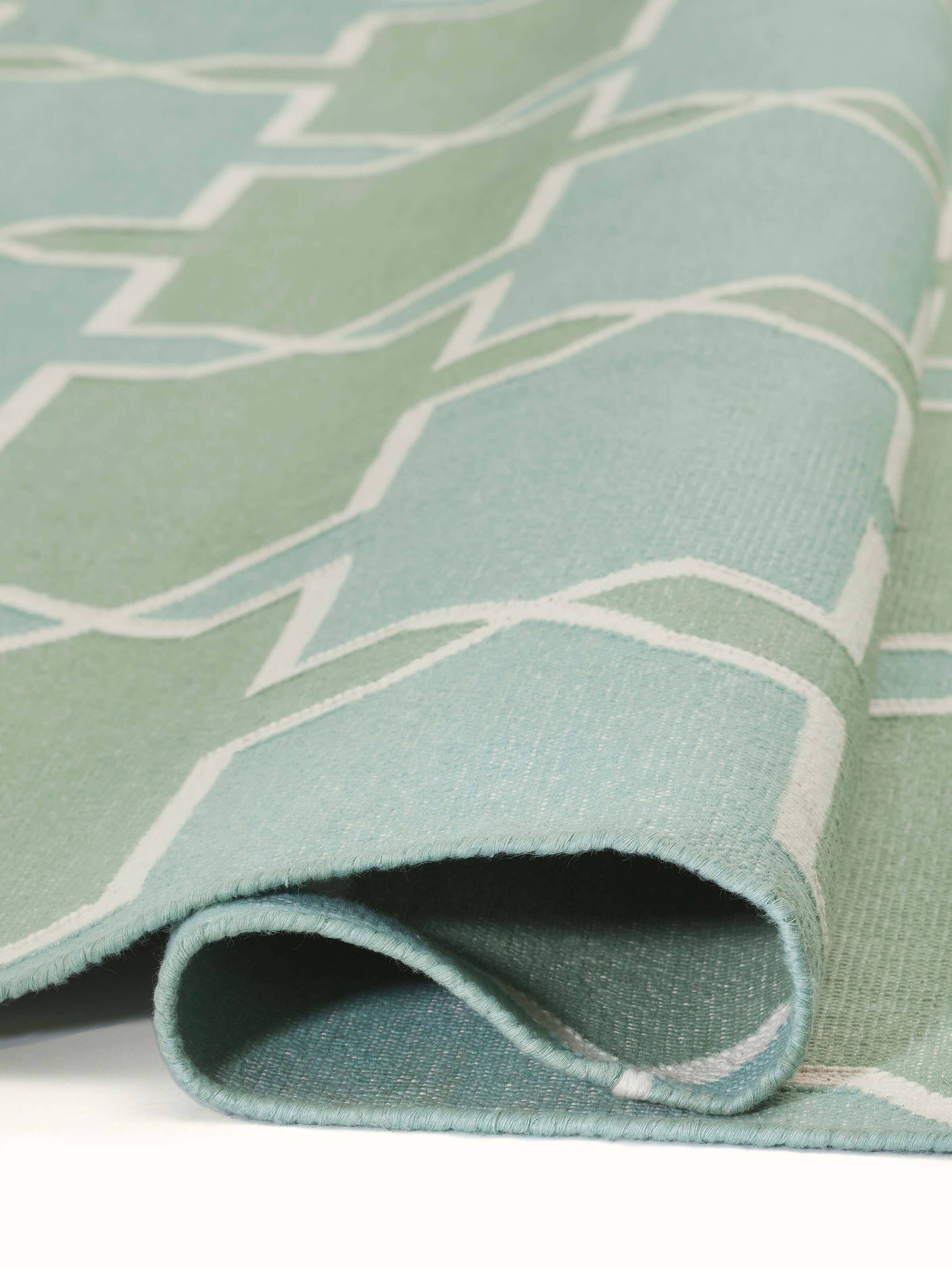 Detailed view of Modern Geo Green Lawan Cotton Panja Dhurrie showing fabric texture and pattern