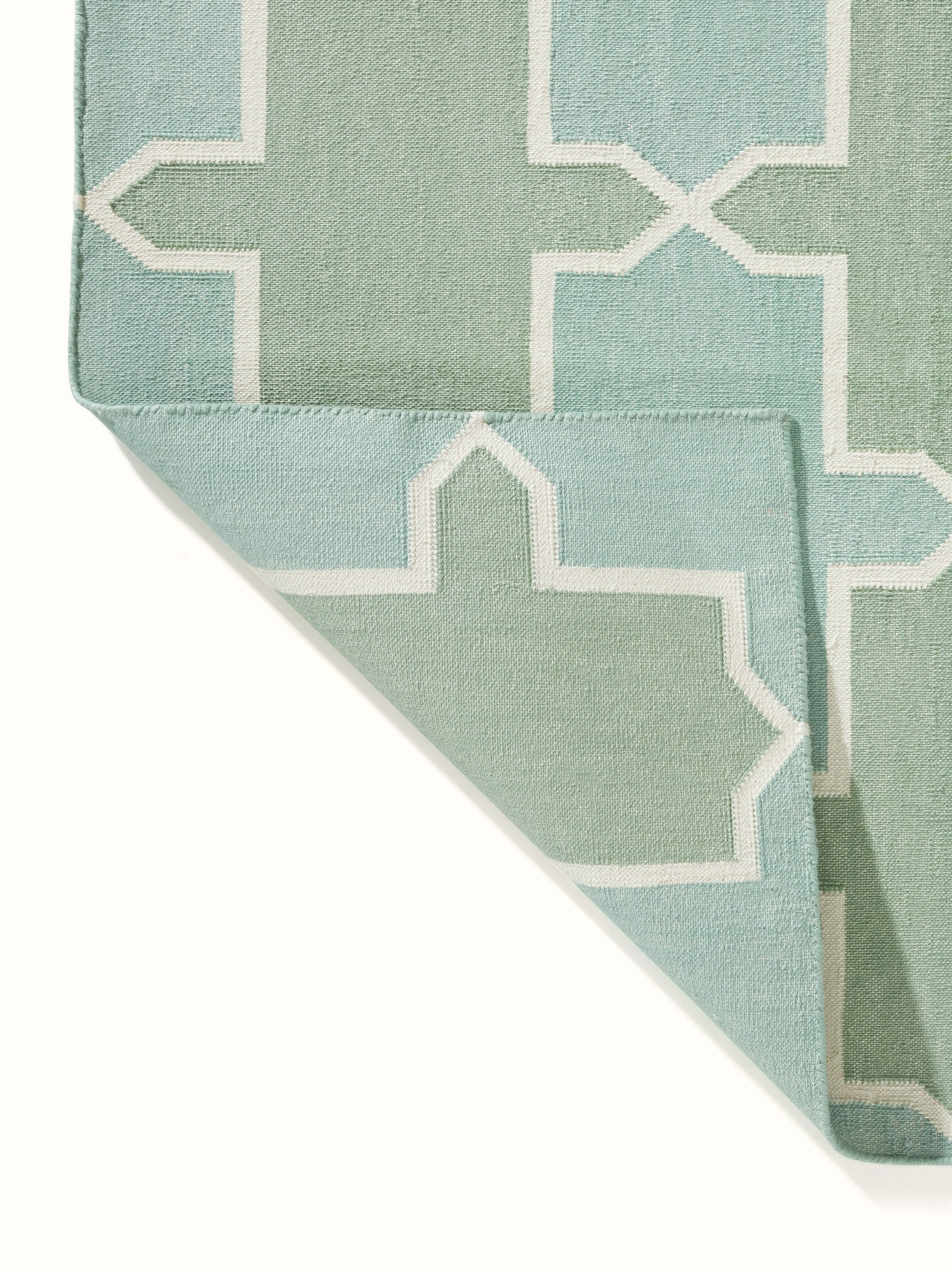 Flat lay of Modern Geo Green Lawan Cotton Panja Dhurrie displaying the overall pattern and color scheme