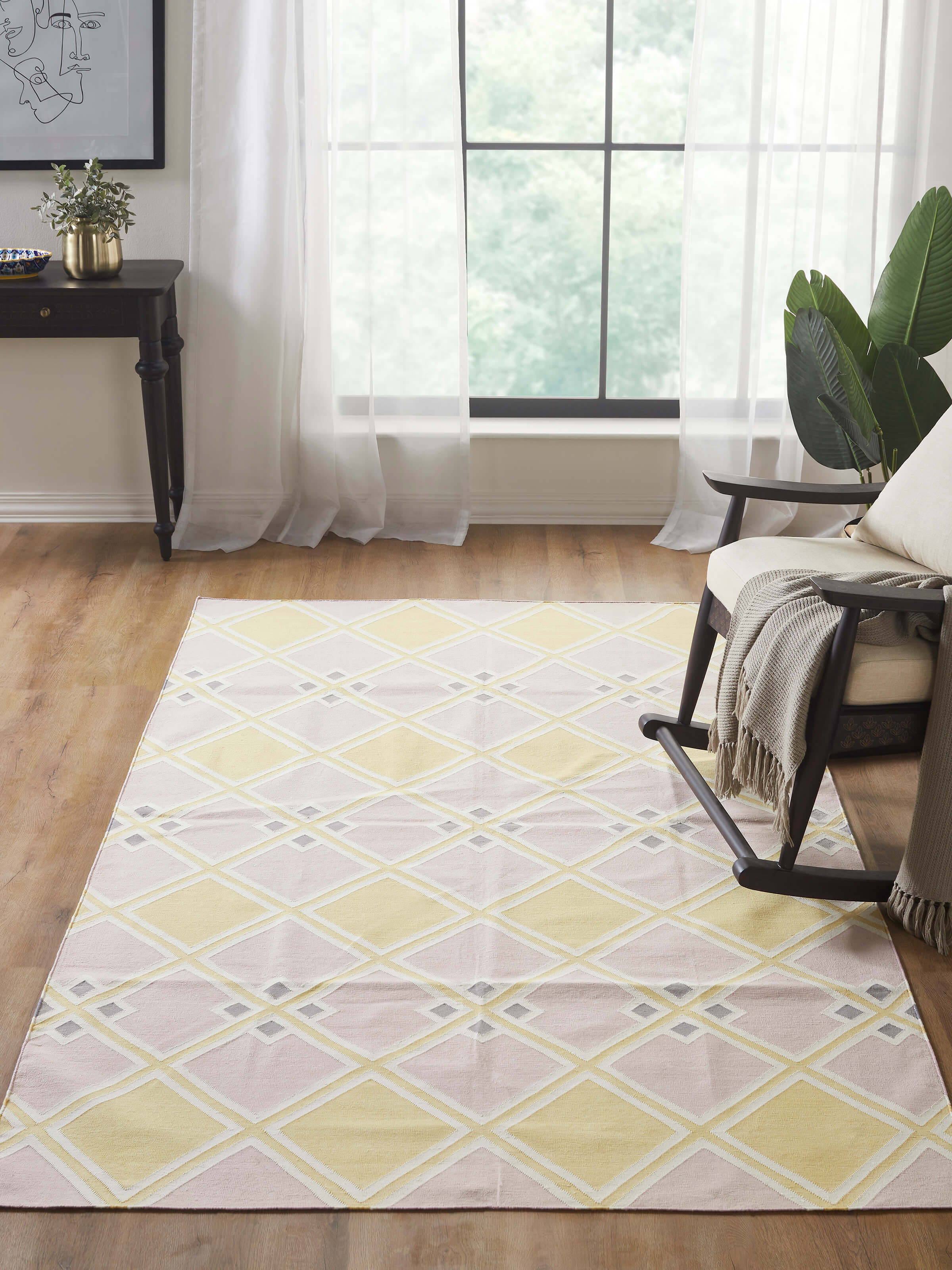 Close-up of Modern geo light pink lawan cotton panja dhurrie showcasing the detailed geometric design and soft cotton.