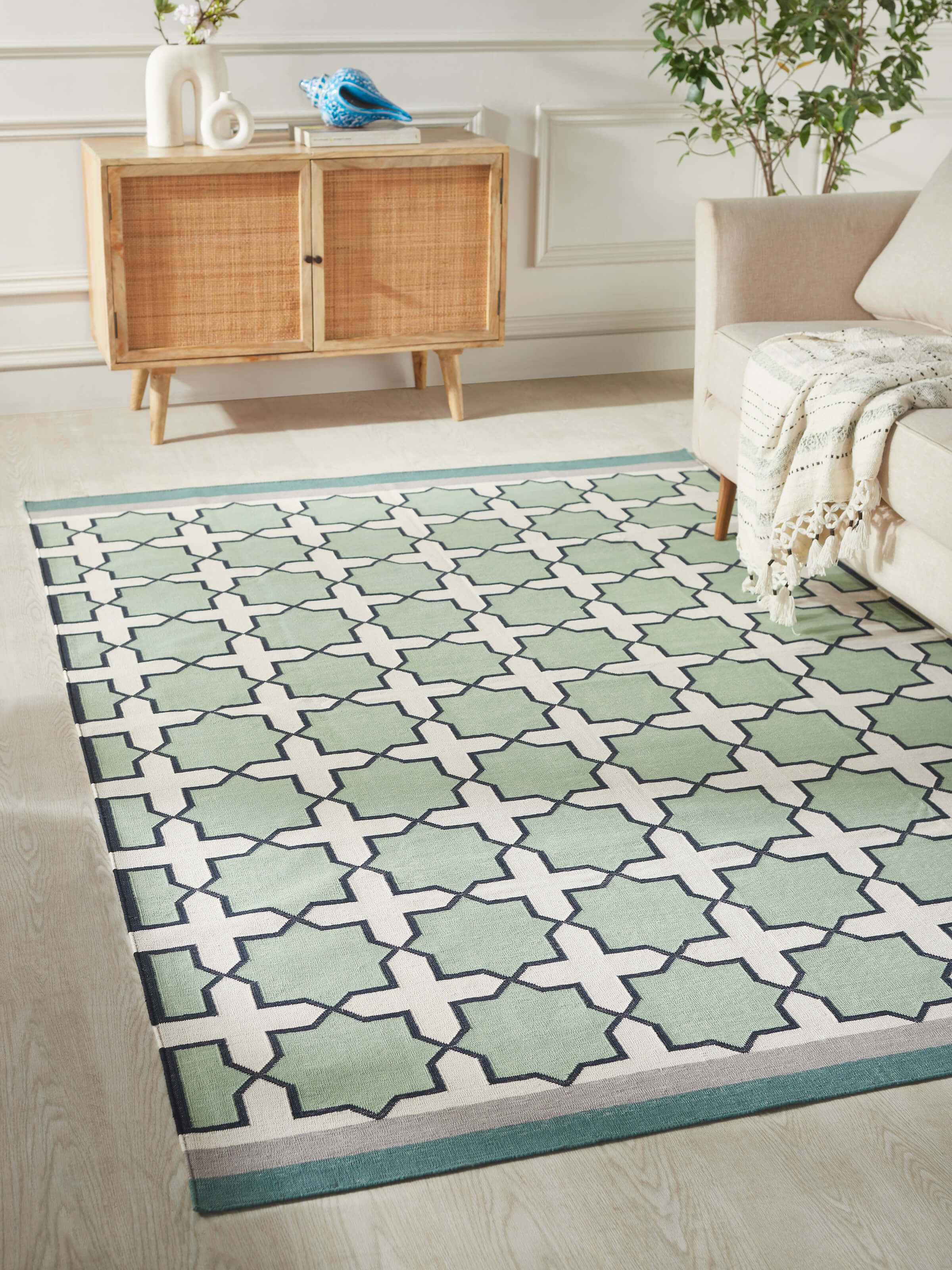 Close-up of Modern Geo Jharokha green grey Lawan cotton Panja dhurrie, highlighting the detailed geometric design and texture