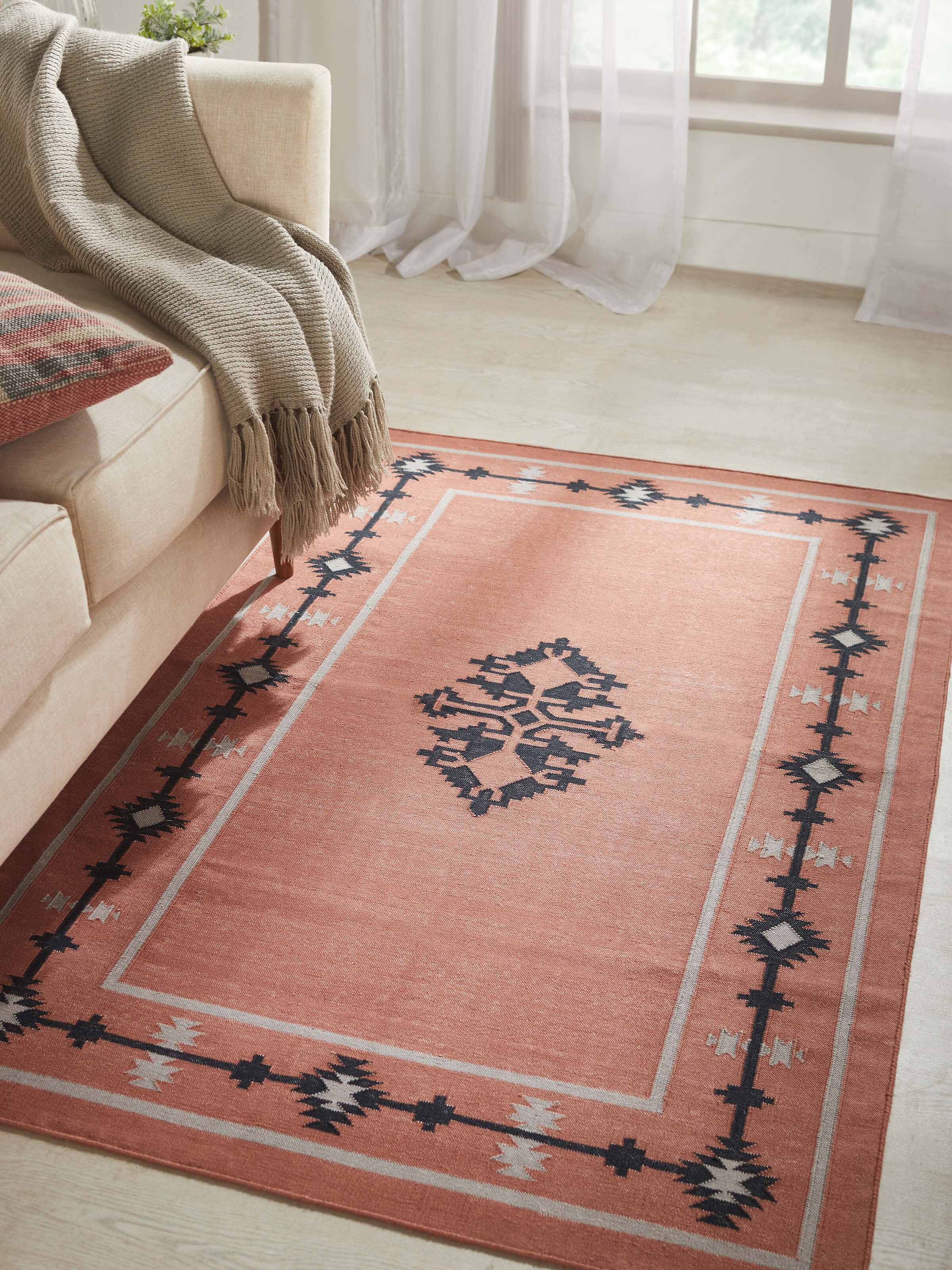 Close-up of Traditional Kilim Rust Lawan Cotton Panja Dhurrie, highlighting the texture and detailed pattern.