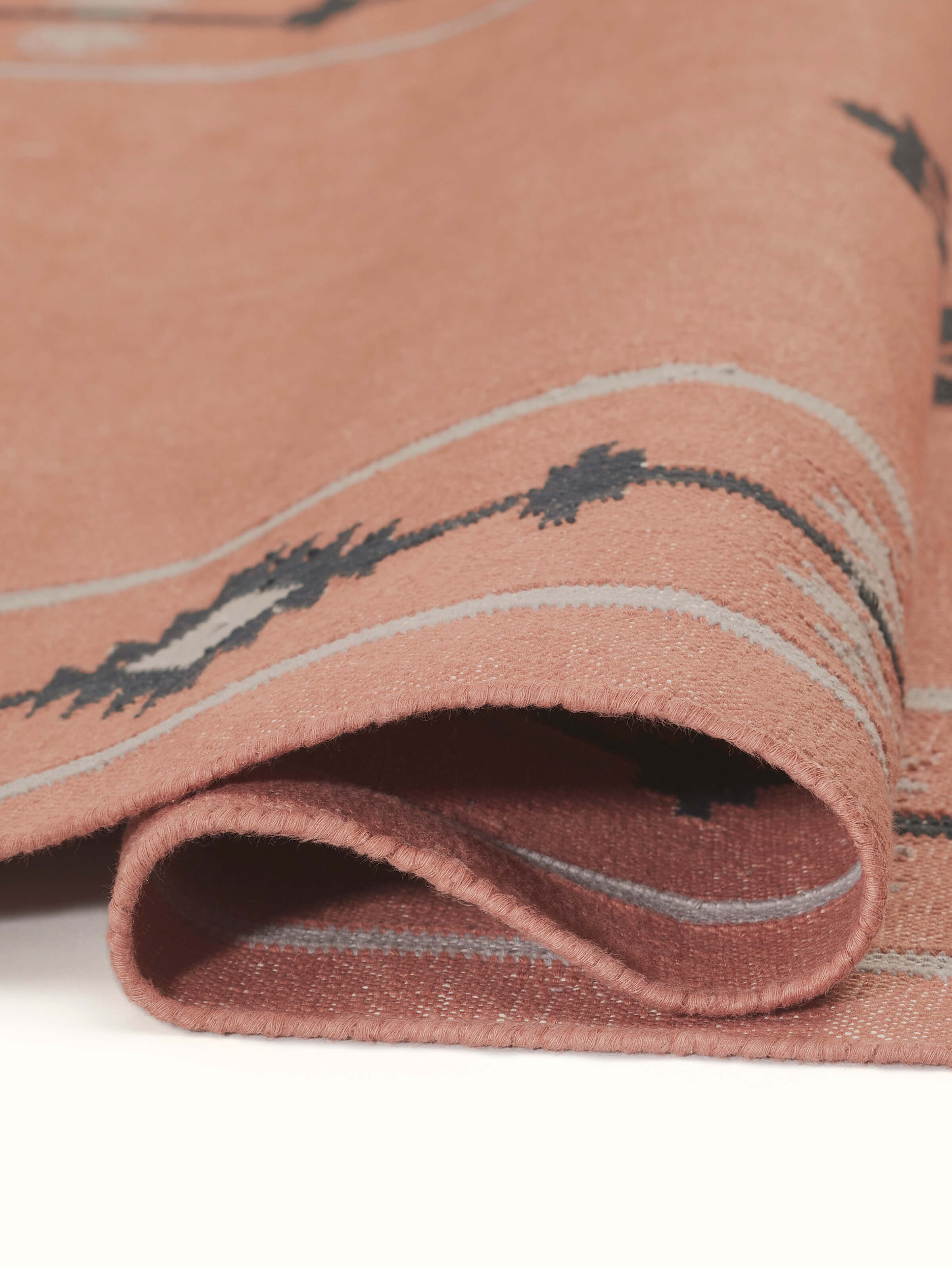 Side view of Traditional Kilim Rust Lawan Cotton Panja Dhurrie, showing the depth and structure of the fabric.