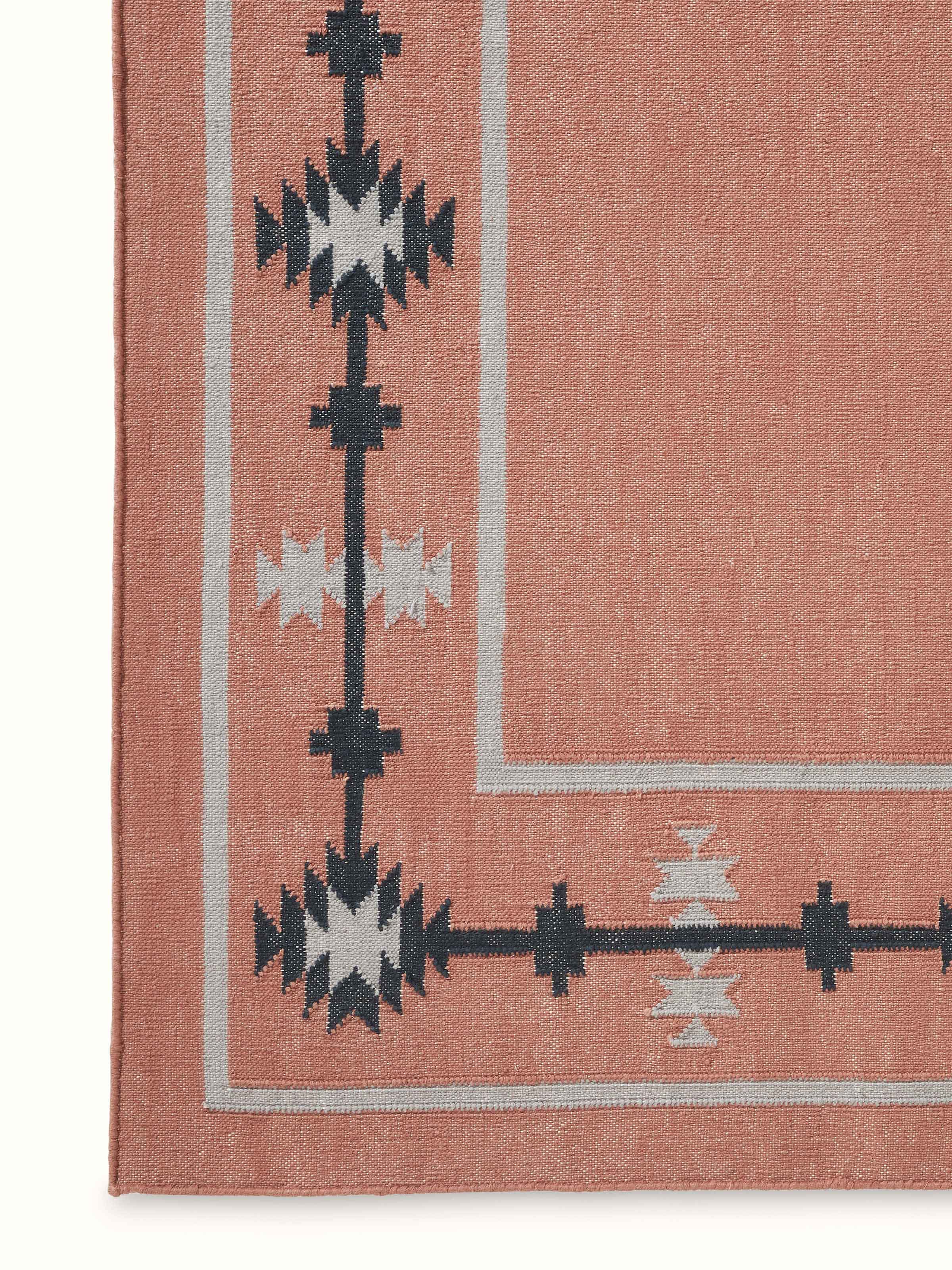 Detailed view of Traditional Kilim Rust Lawan Cotton Panja Dhurrie, focusing on the weave and color details.