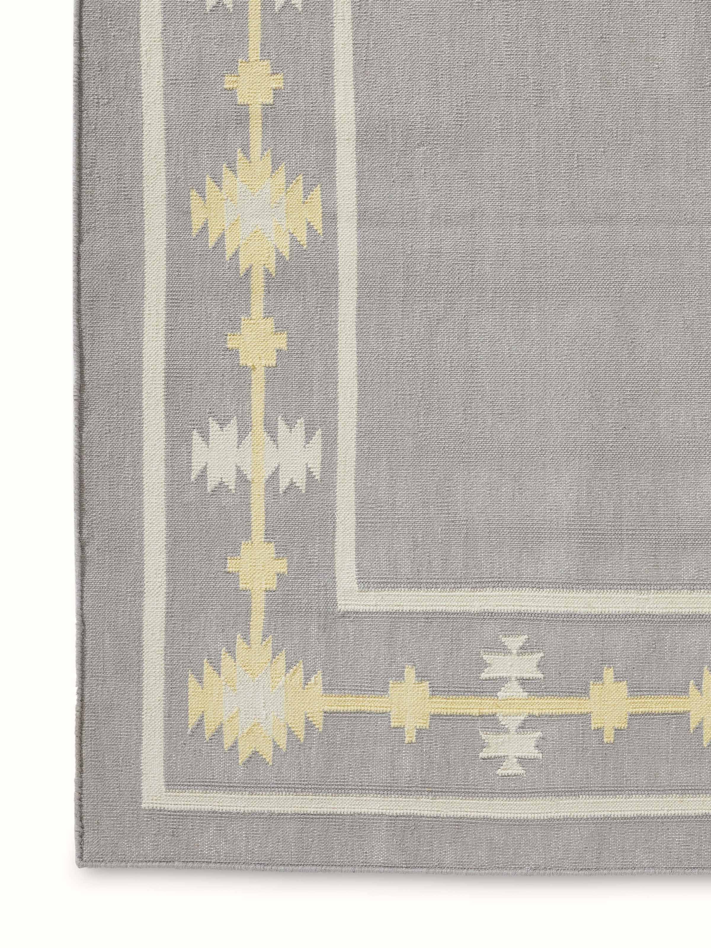 Traditional Kilim grey yellow Lawan cotton Panja dhurrie, displaying its pattern and texture