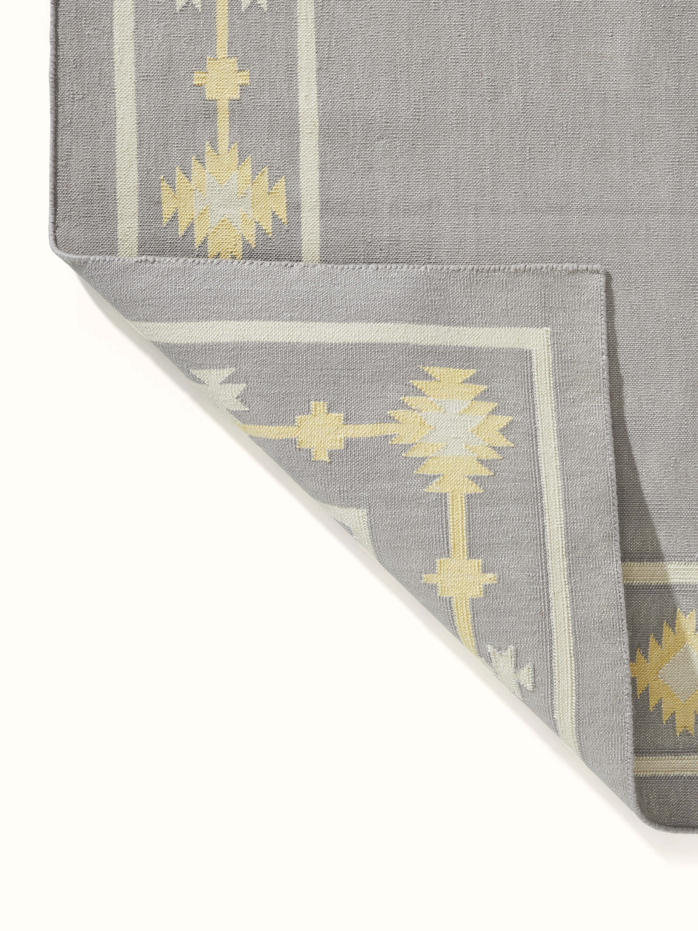 Close-up of Traditional Kilim grey yellow Lawan cotton Panja dhurrie, showing the weave and color details