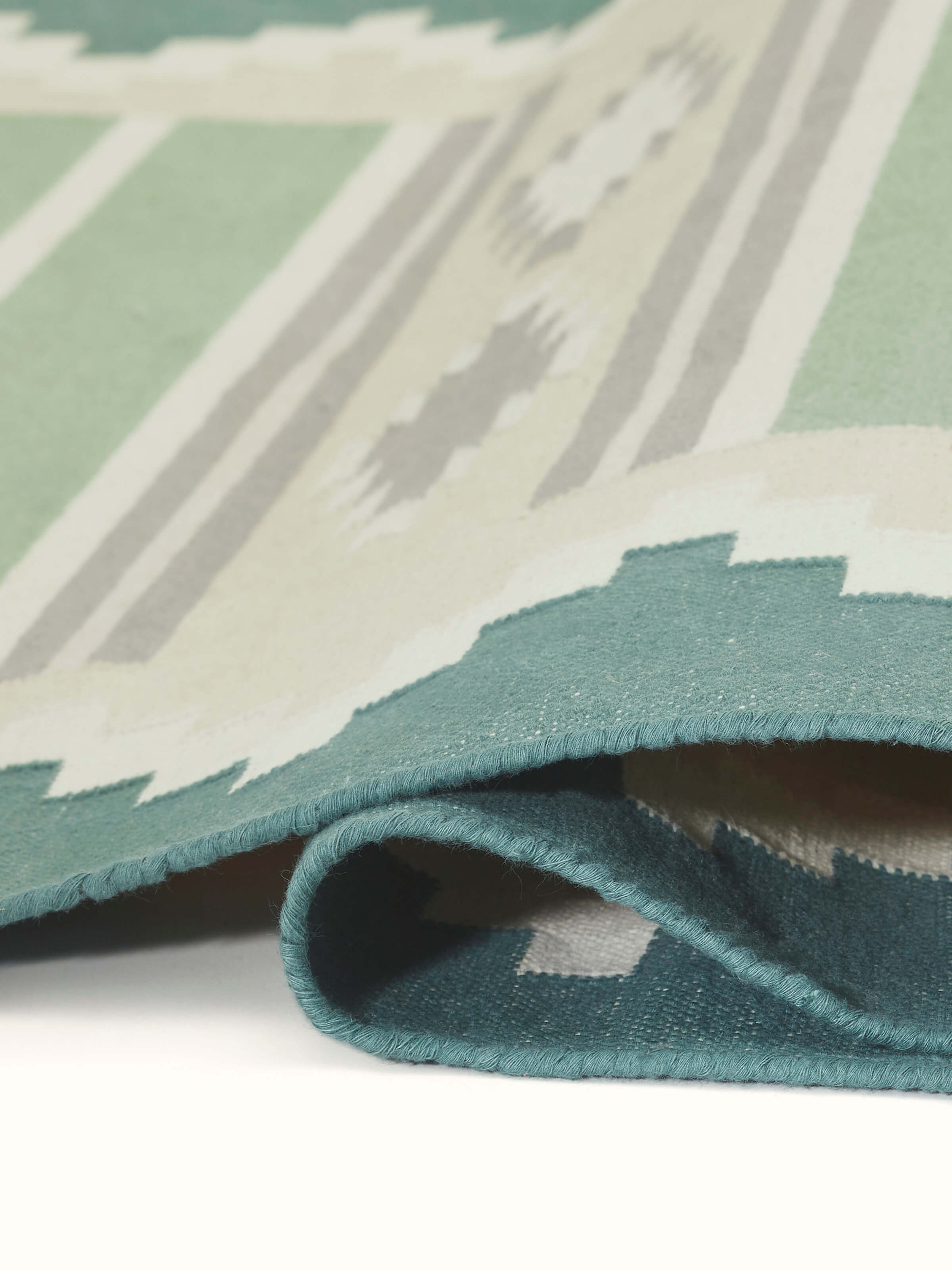 Close-up view of Modern Geo green lawan cotton panja runner