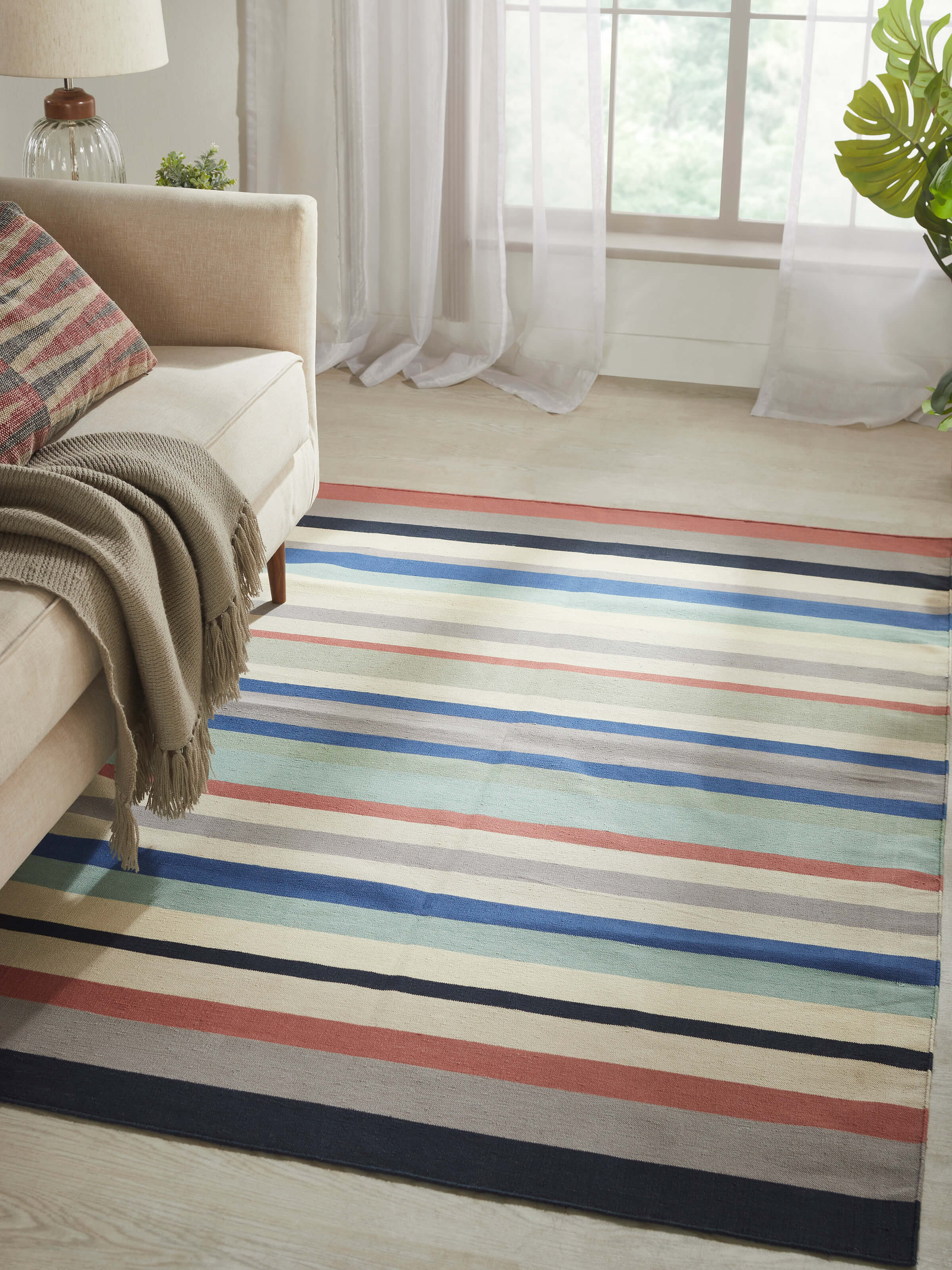 Close-up of Modern Geo Stripe Lawan Cotton Panja Dhurrie, focusing on the texture and intricate details of the stripes.