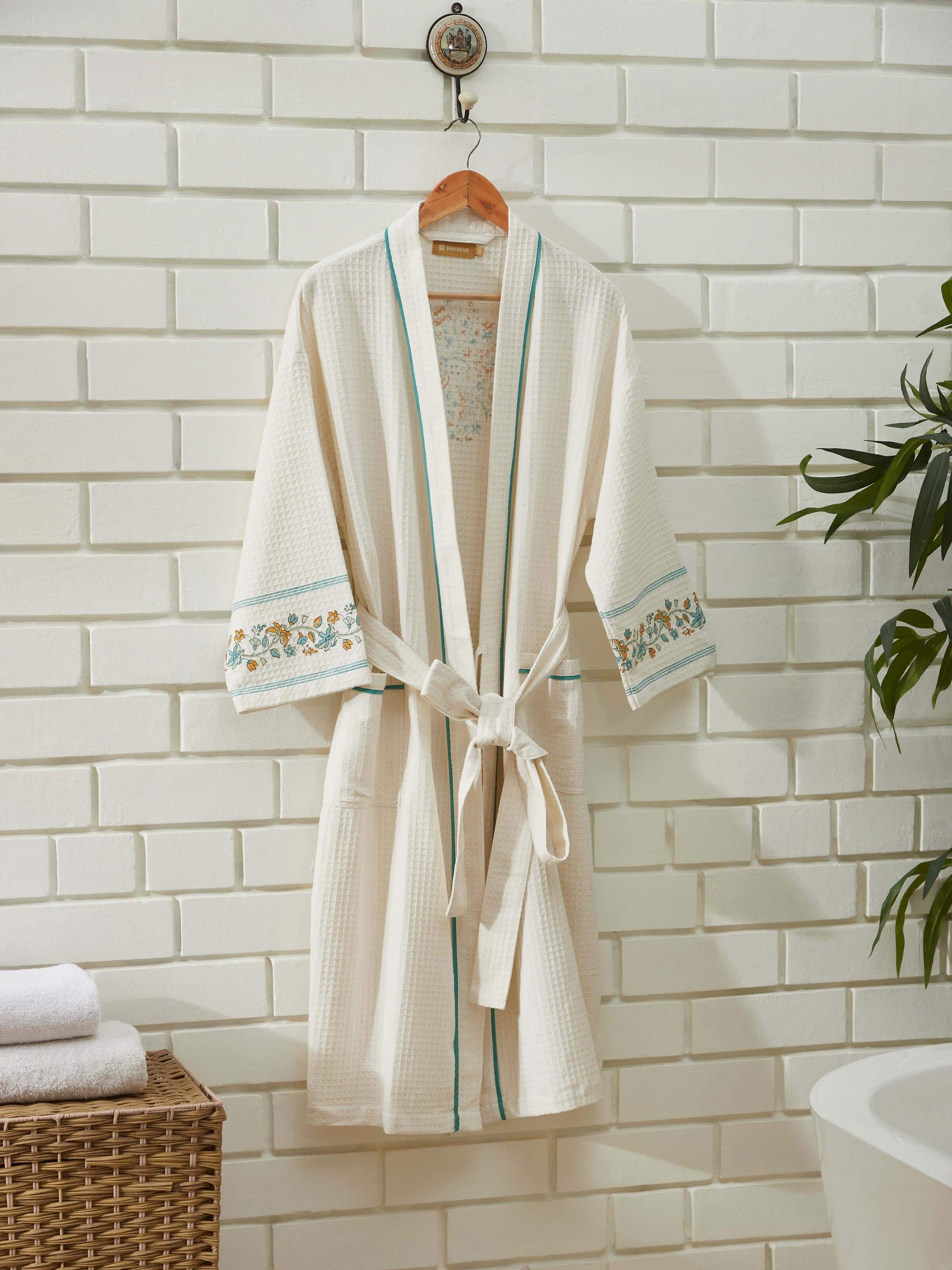 Angled view of Multi Floral Cotton Sanganeri Block Printed Bathrobe, showing the robe in a relaxed setting.