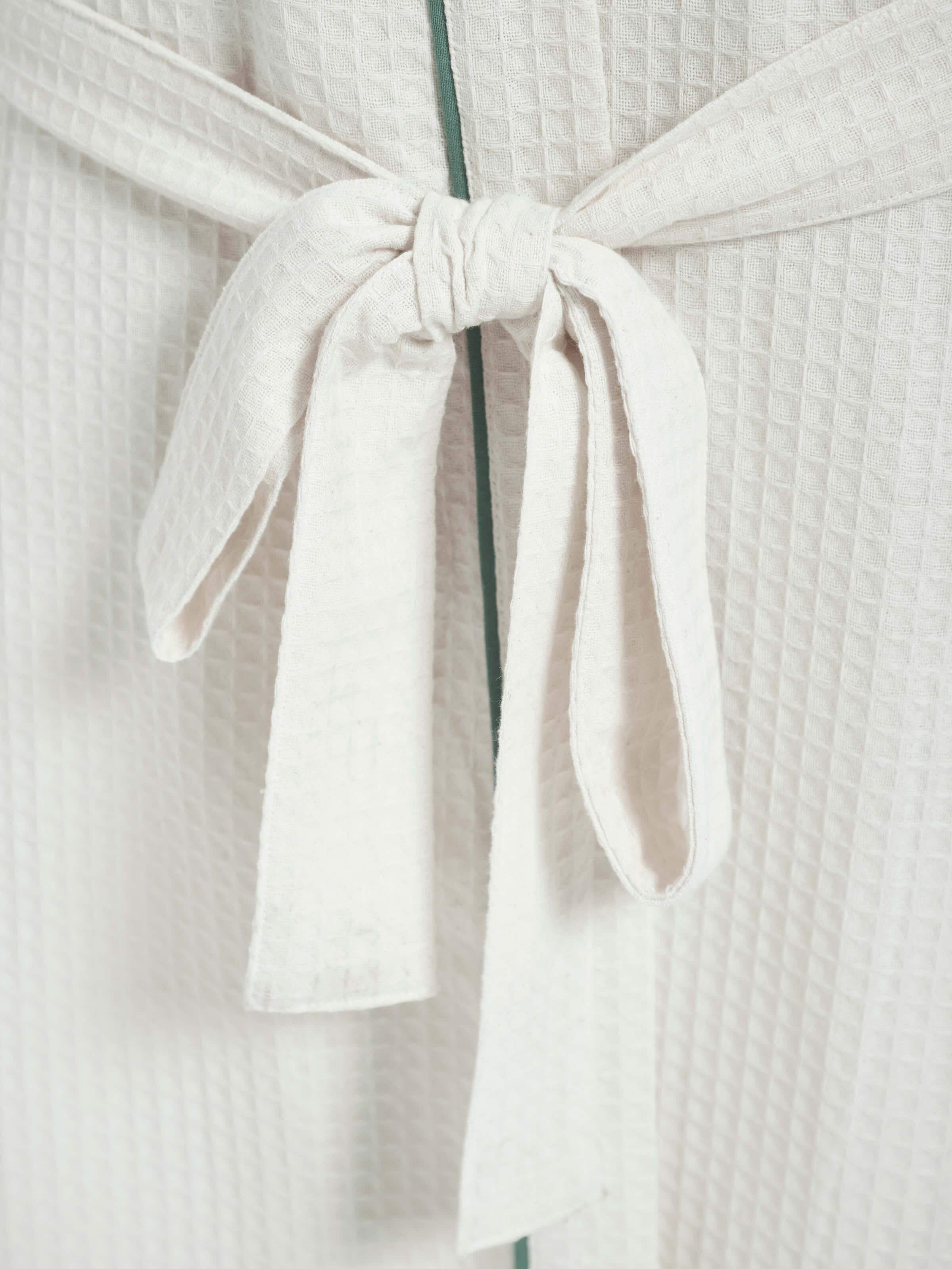 Full view of Multi Floral Cotton Sanganeri Block Printed Bathrobe draped on a hook, showcasing the overall design.