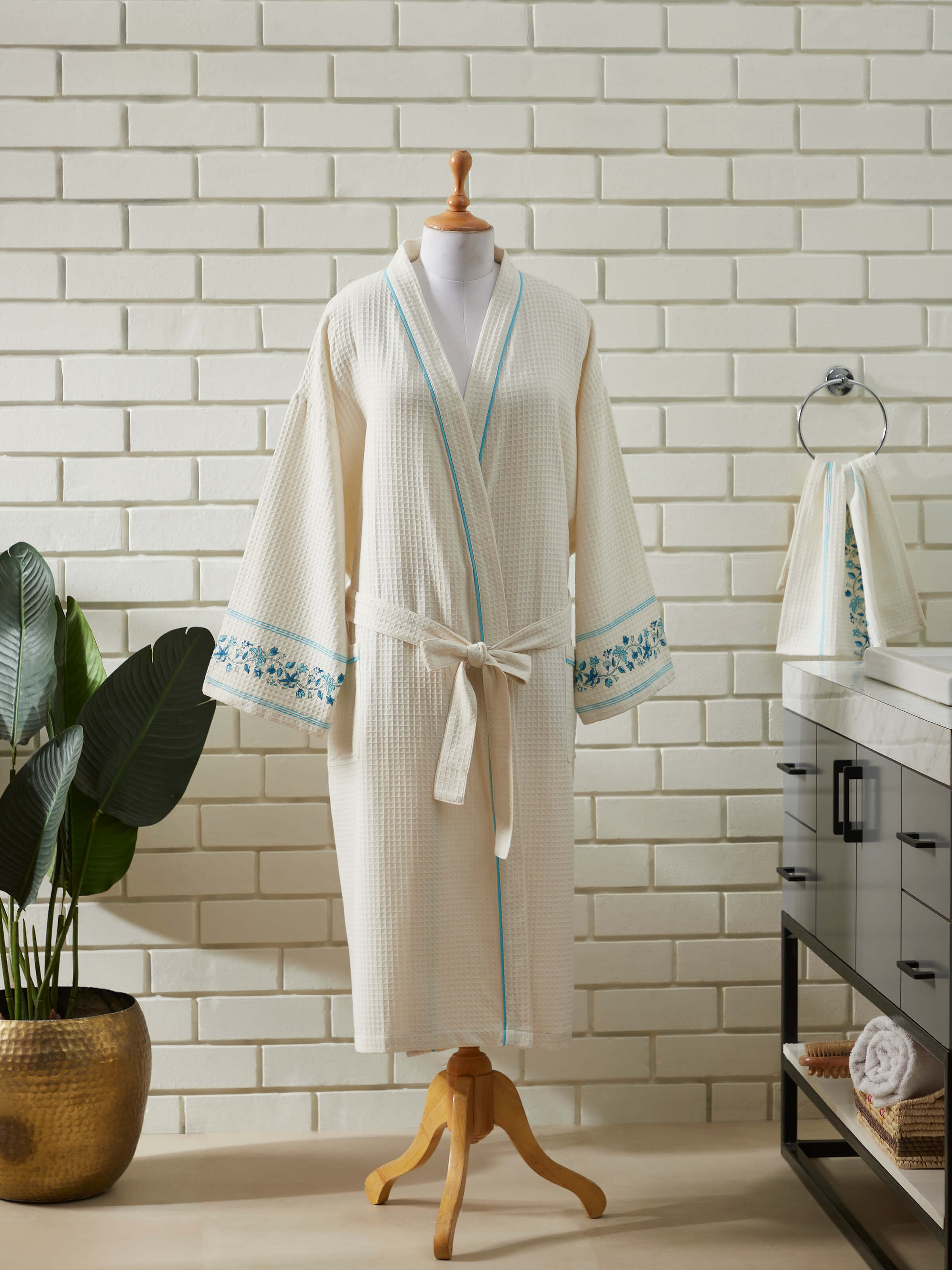 Close-up of Blue floral cotton Sanganeri block printed bathrobe focusing on the intricate block print and soft cotton fabric.