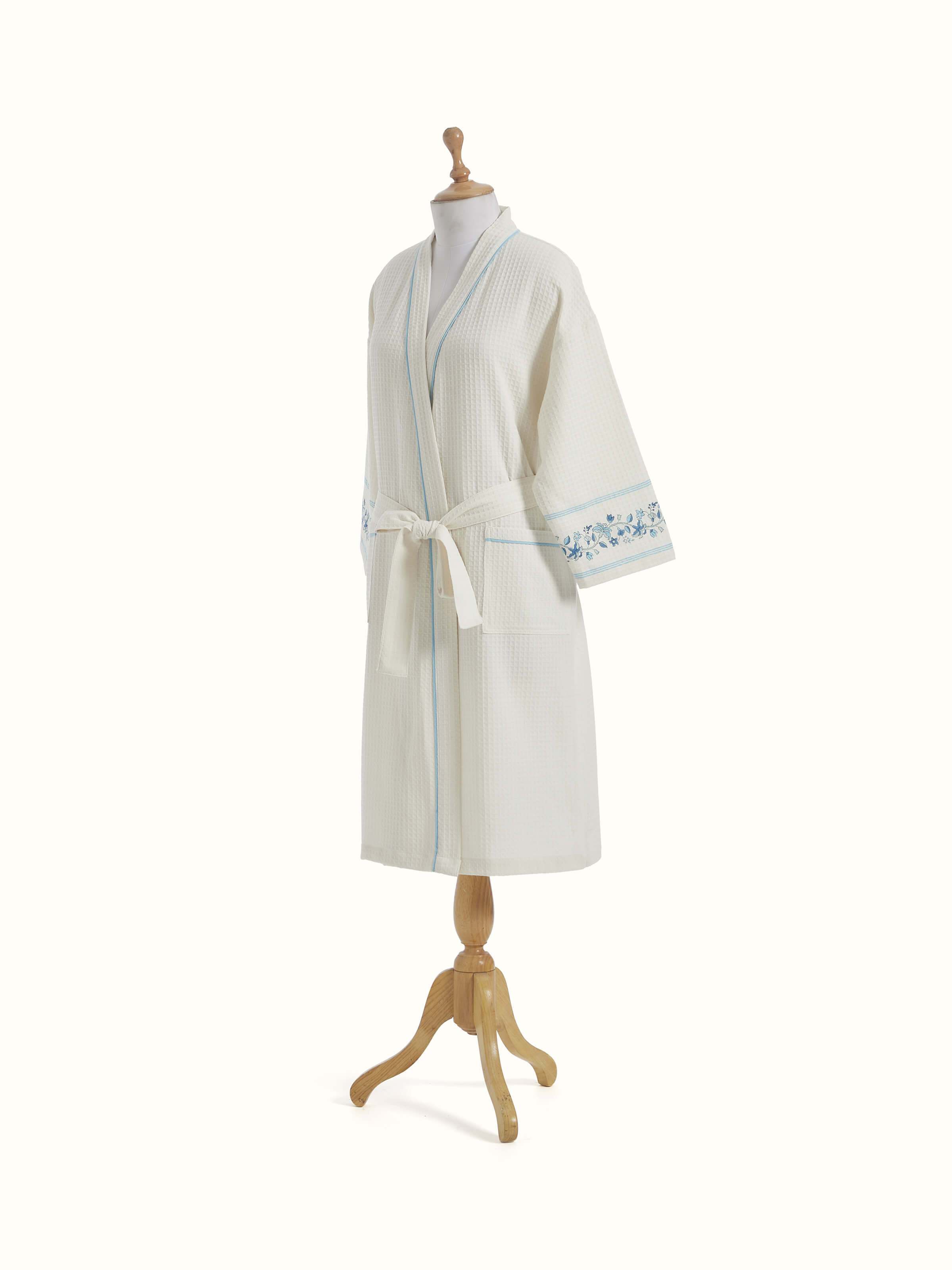 Angled view of Blue floral cotton Sanganeri block printed bathrobe displaying the overall pattern and comfortable fit.