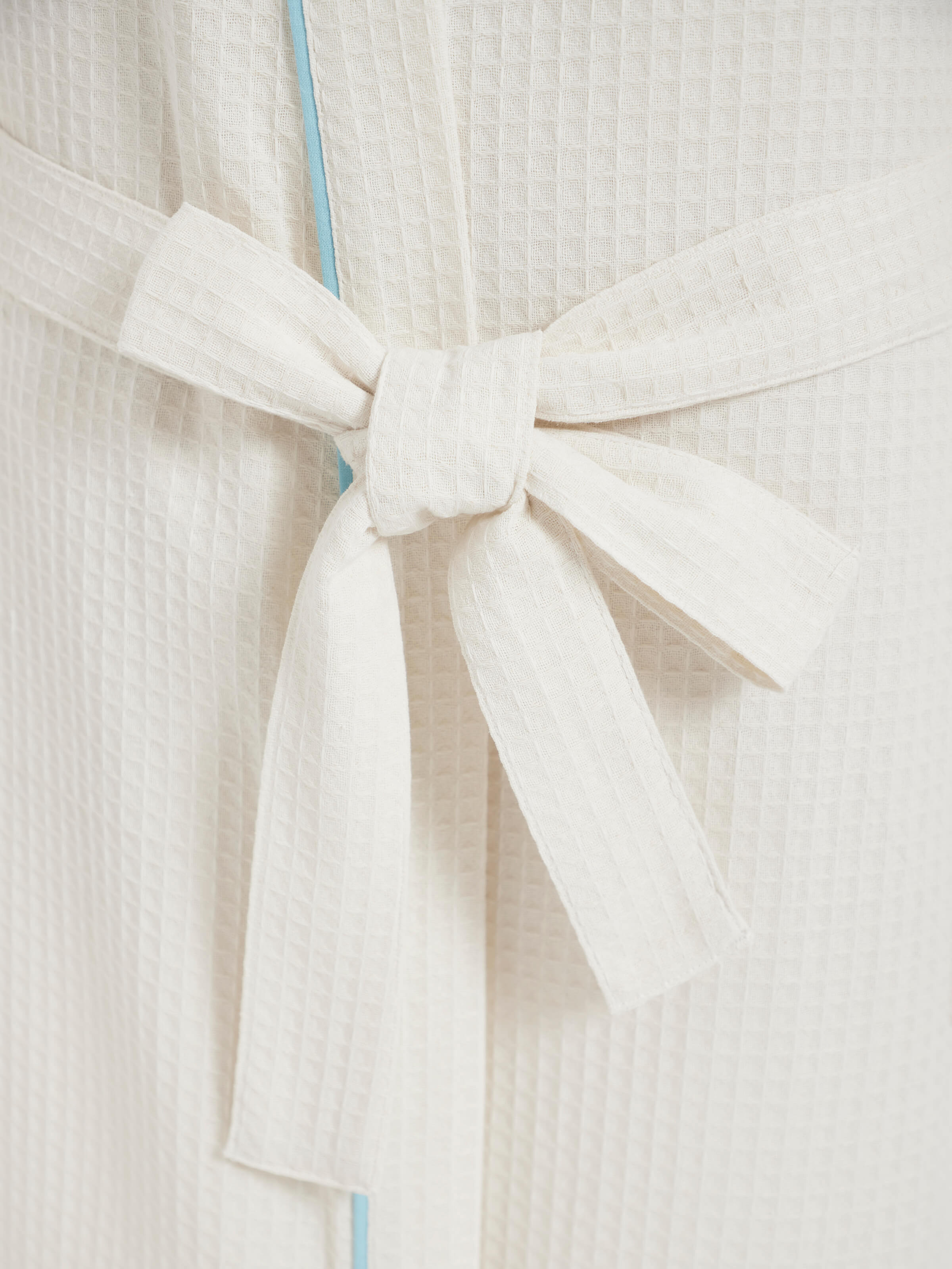 Detailed view of Blue floral cotton Sanganeri block printed bathrobe showing the softness of the fabric and clarity of the print.