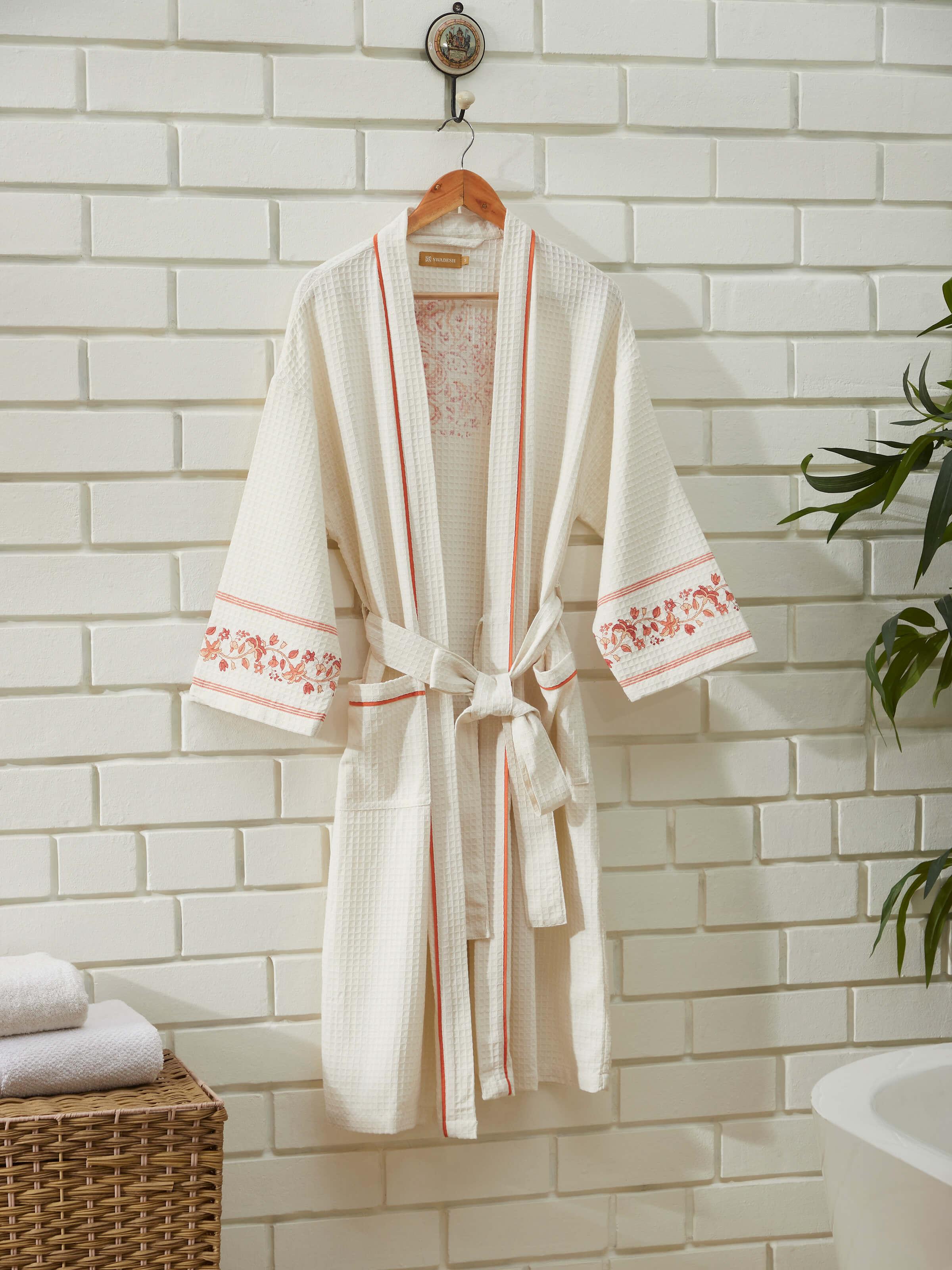 Close-up of Palampore buta peach floral cotton Sanganeri block printed bathrobe illustrating floral print details