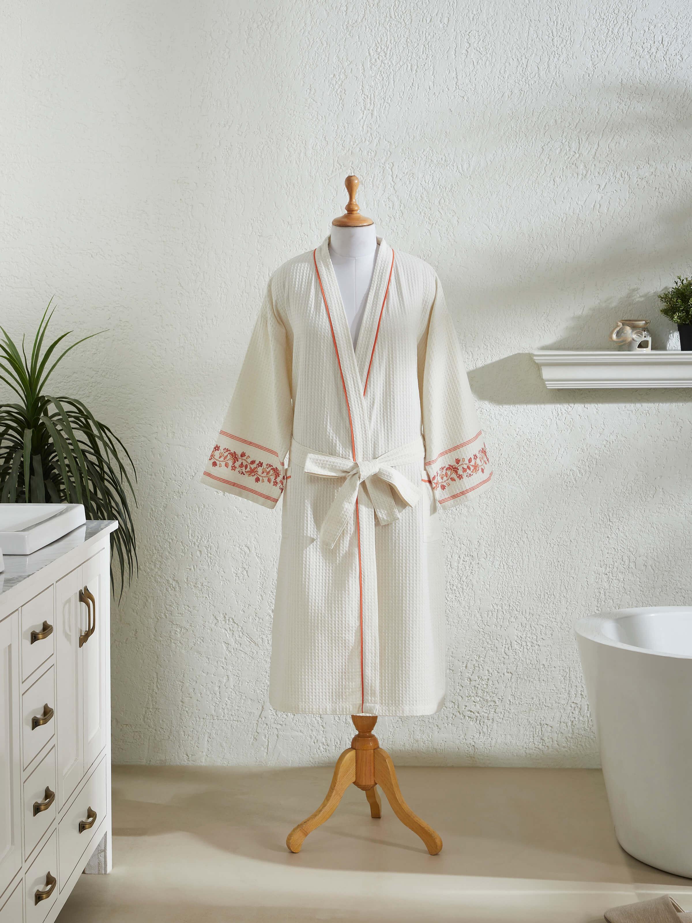 Side view of Palampore buta peach floral cotton Sanganeri block printed bathrobe displaying robe’s structure and design