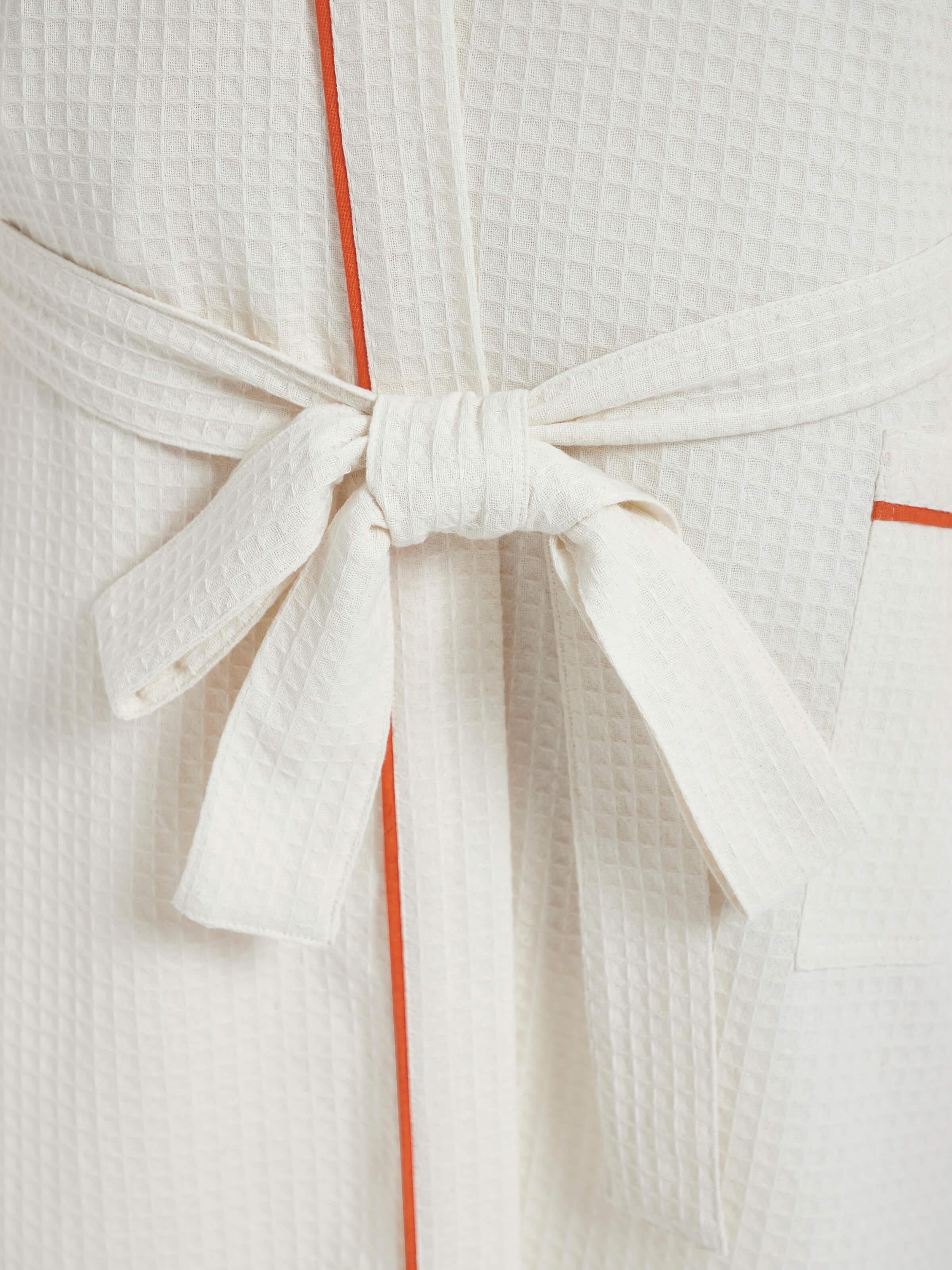 Front view of Palampore buta peach floral cotton Sanganeri block printed bathrobe with floral details and design