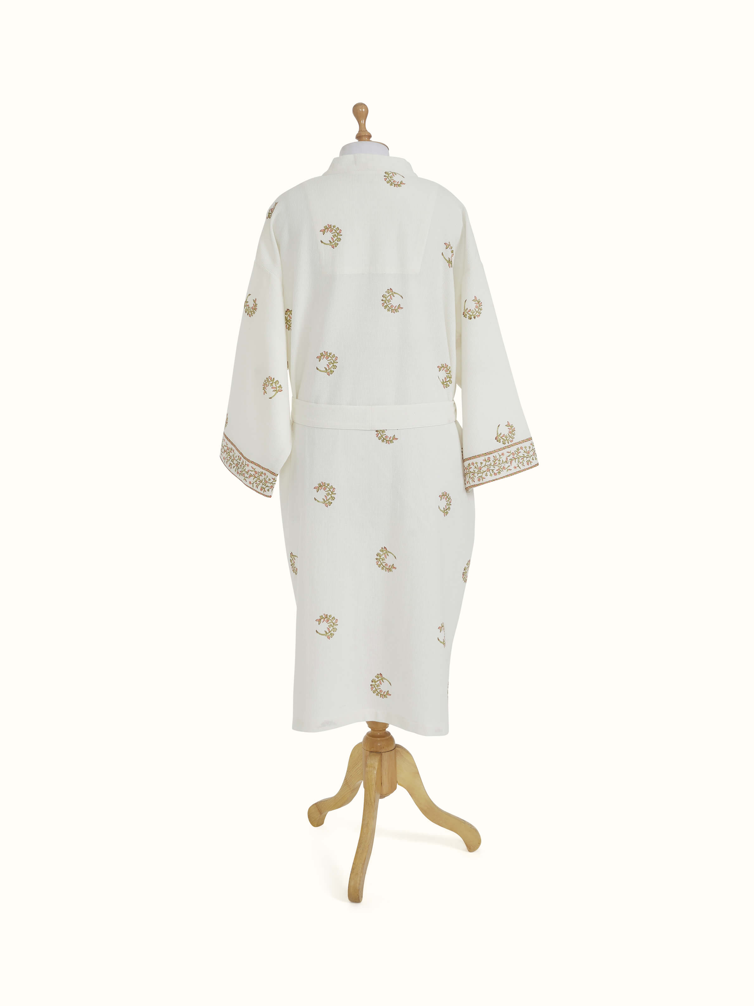 Close-up of Ambi Buta peach floral pattern on Sanganeri block printed cotton bathrobe