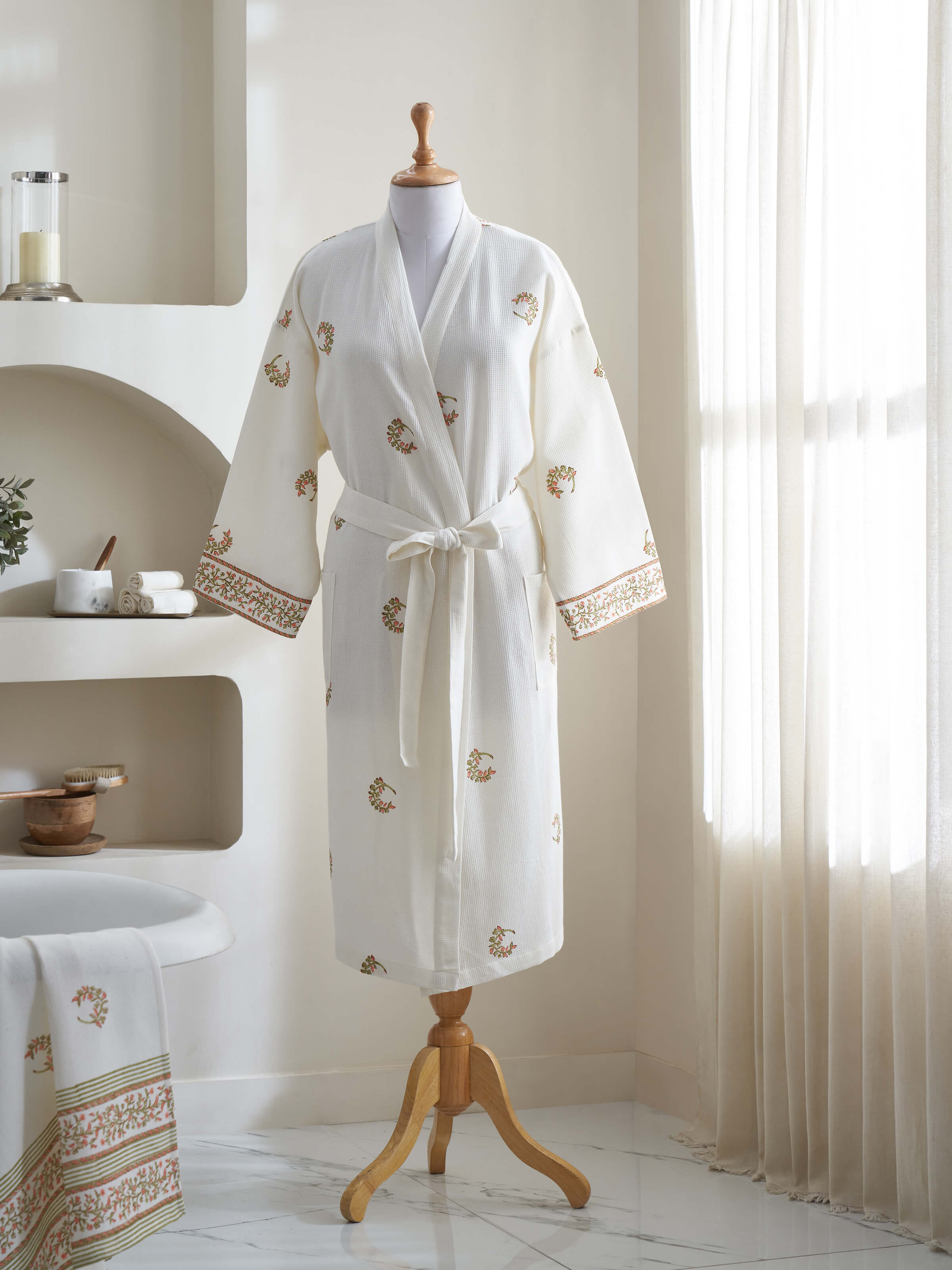 Side view of Ambi Buta peach floral cotton Sanganeri block printed bathrobe