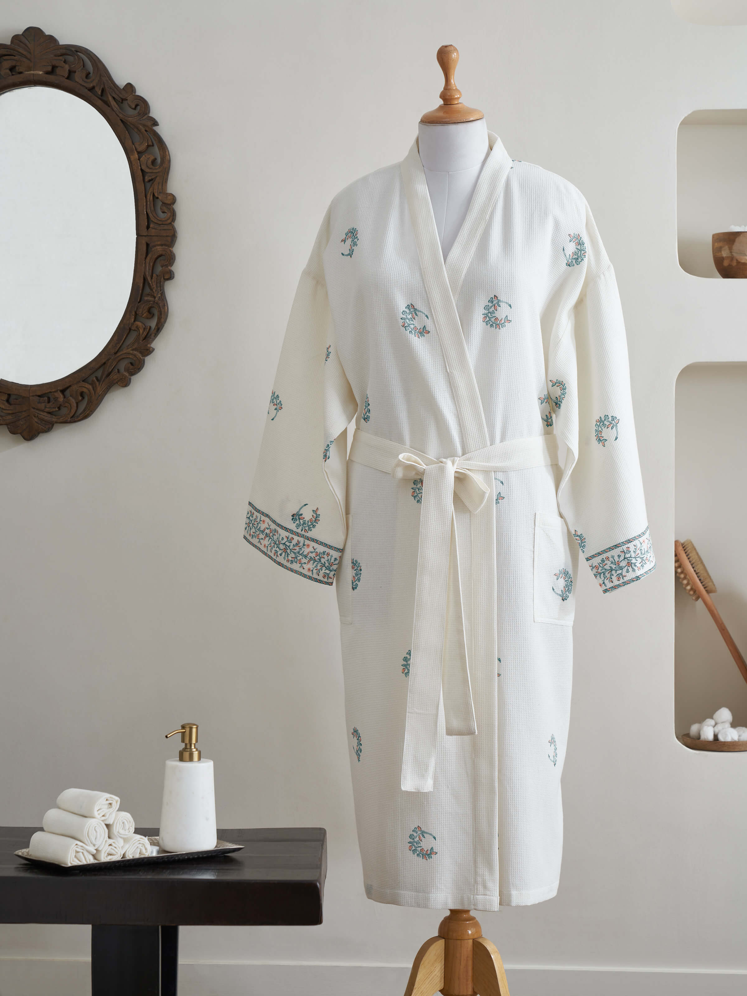 Side view of the blue floral cotton Sanganeri block printed bathrobe highlighting the robe’s fabric and pattern