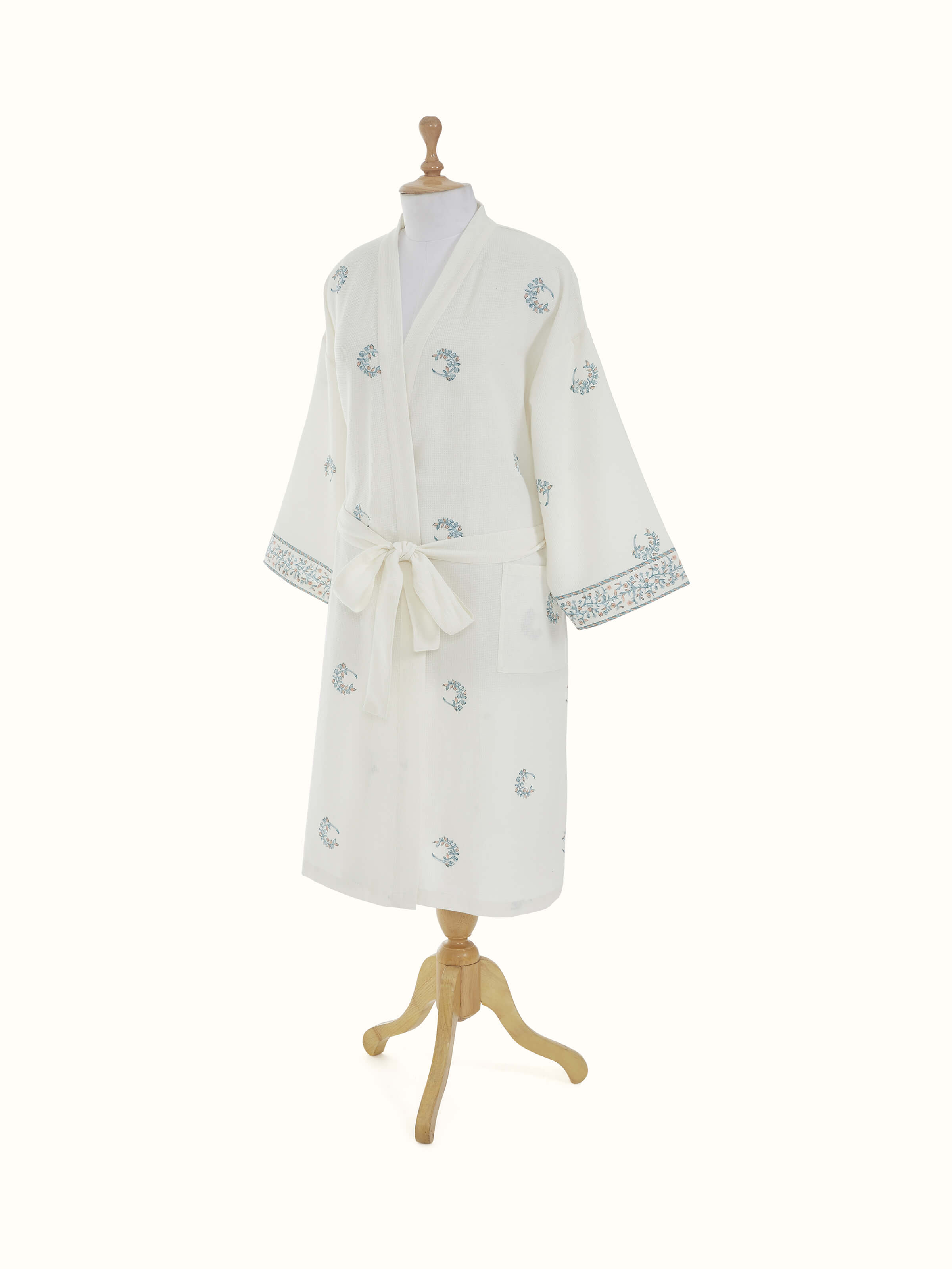 Blue floral Sanganeri block printed cotton bathrobe with a focus on the robe's overall design and fit