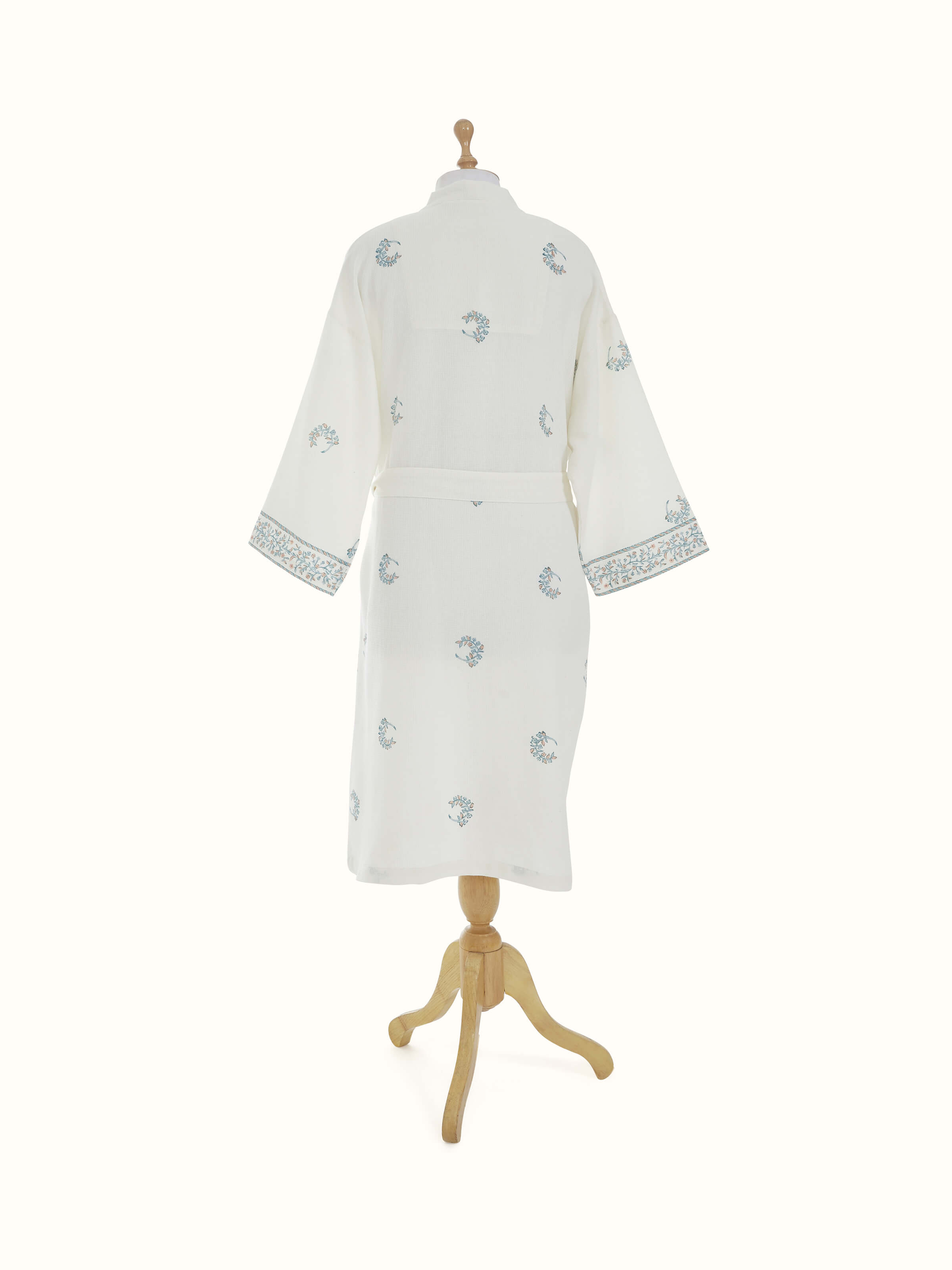 Blue floral cotton bathrobe from a different angle, showcasing its design and how it drapes