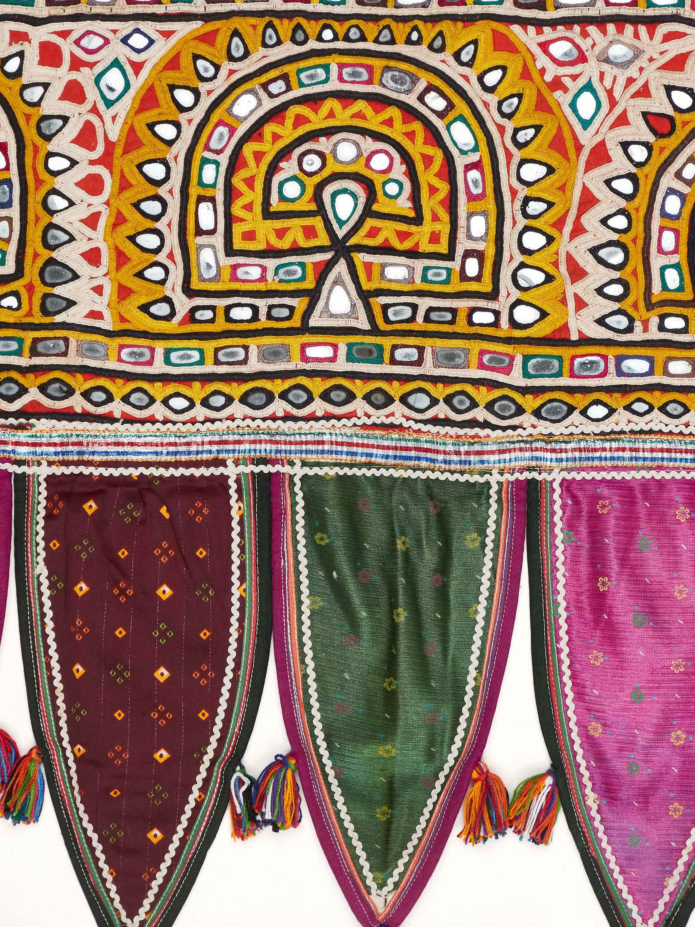 Close-up view of Kutch embroidery patterned toran showing intricate stitching and design patterns