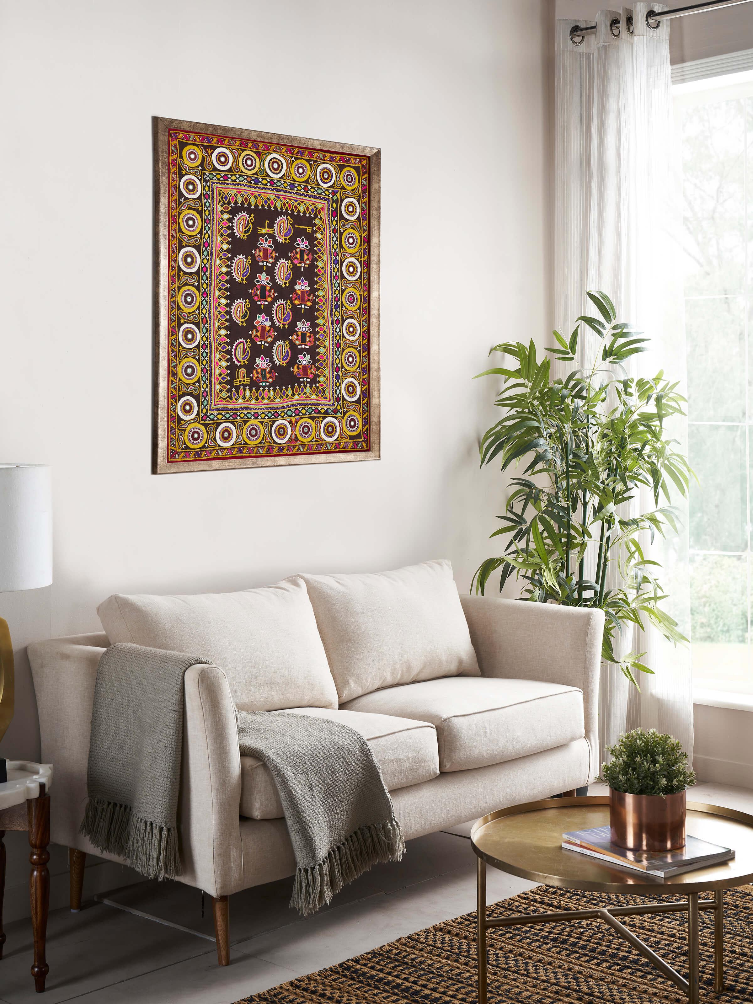 Close-up view of Kutch embroidery flowers & birds wall hanging highlighting intricate stitchwork.