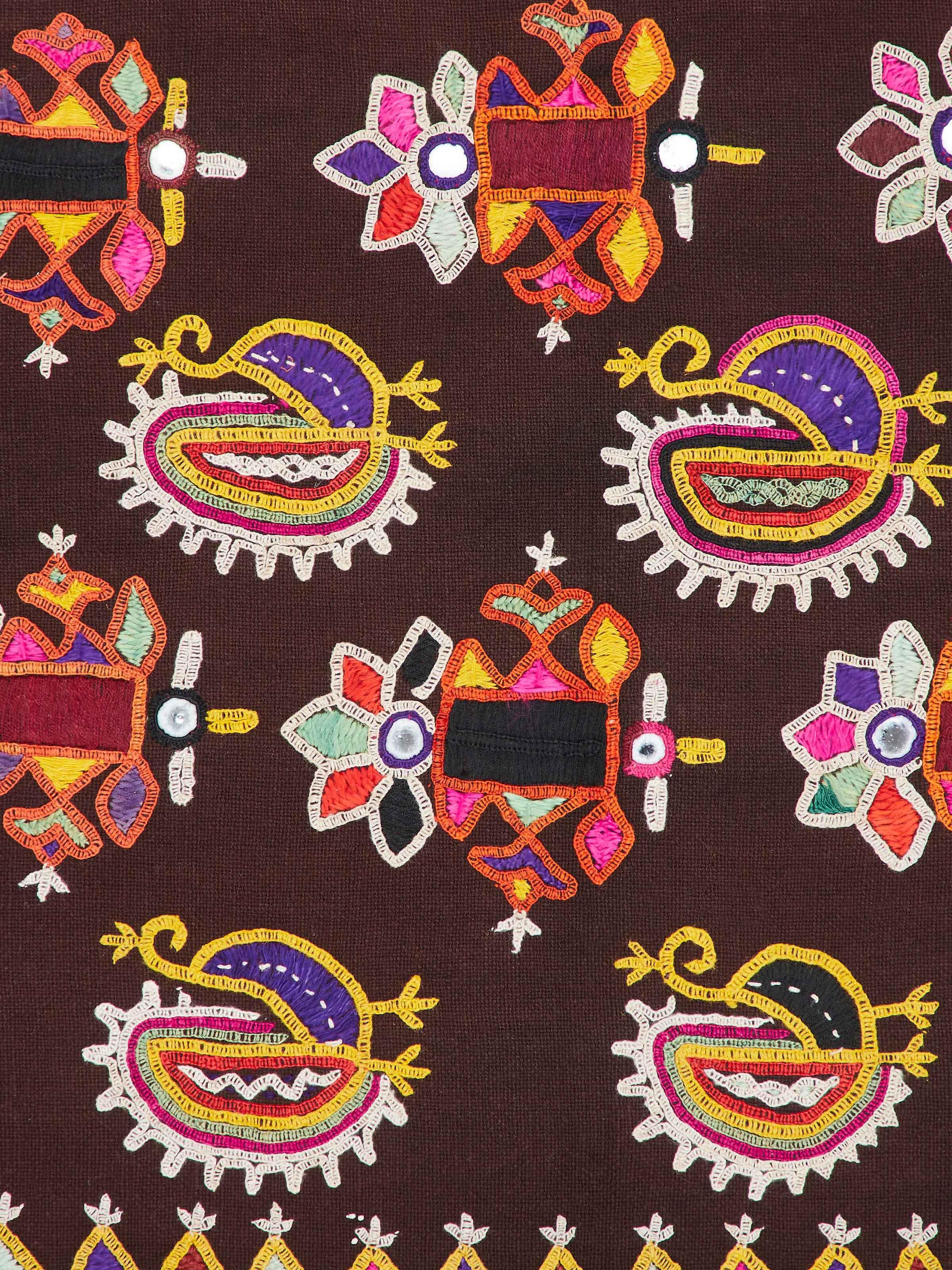 Detailed view of Kutch embroidery flowers & birds wall hanging emphasizing rich colors and patterns.