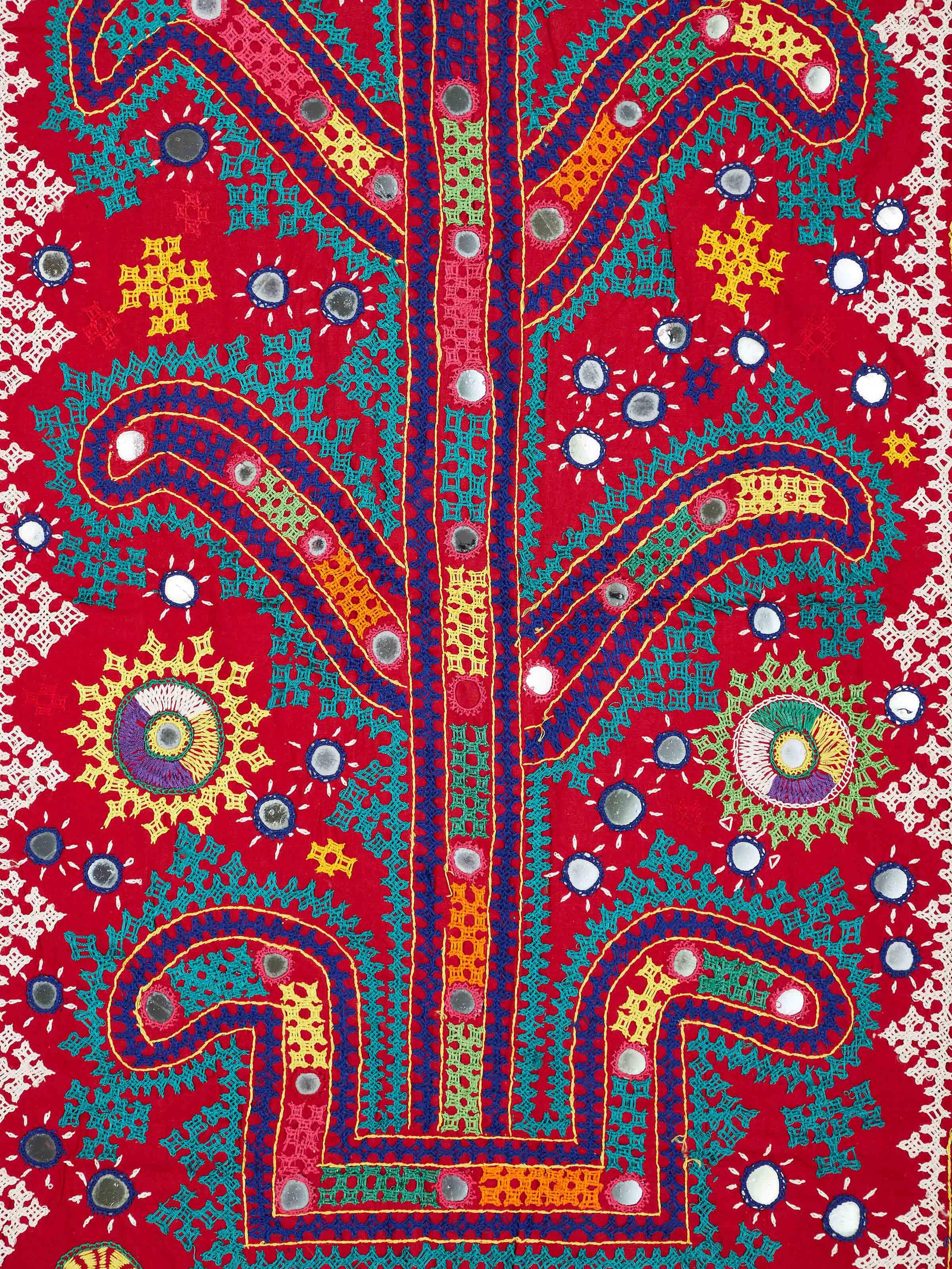 Detailed close-up of Kutch embroidery tree & birds wall hanging with vibrant colors and design