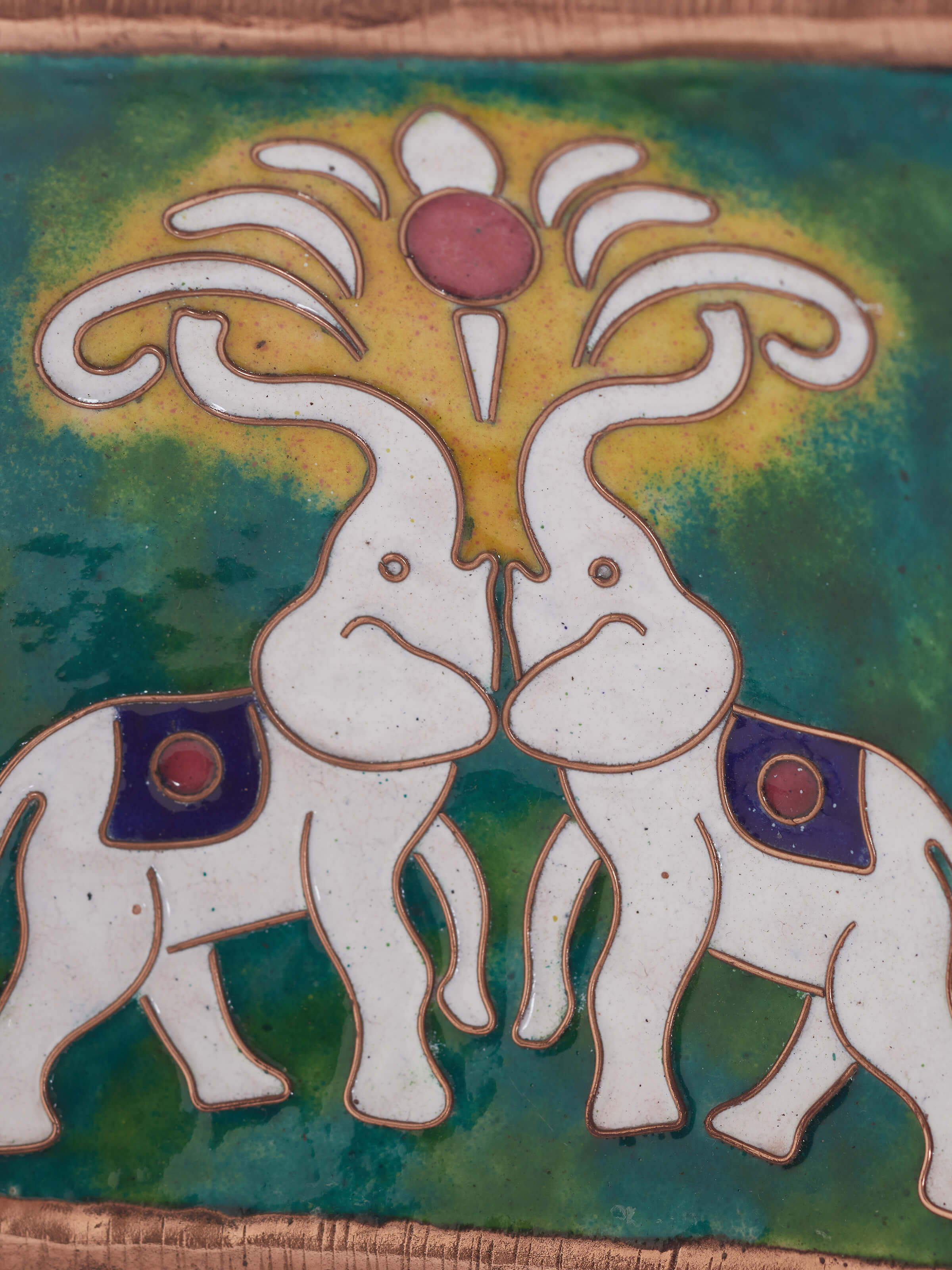 Copper tray with detailed close-up, emphasizing its traditional design and quality.