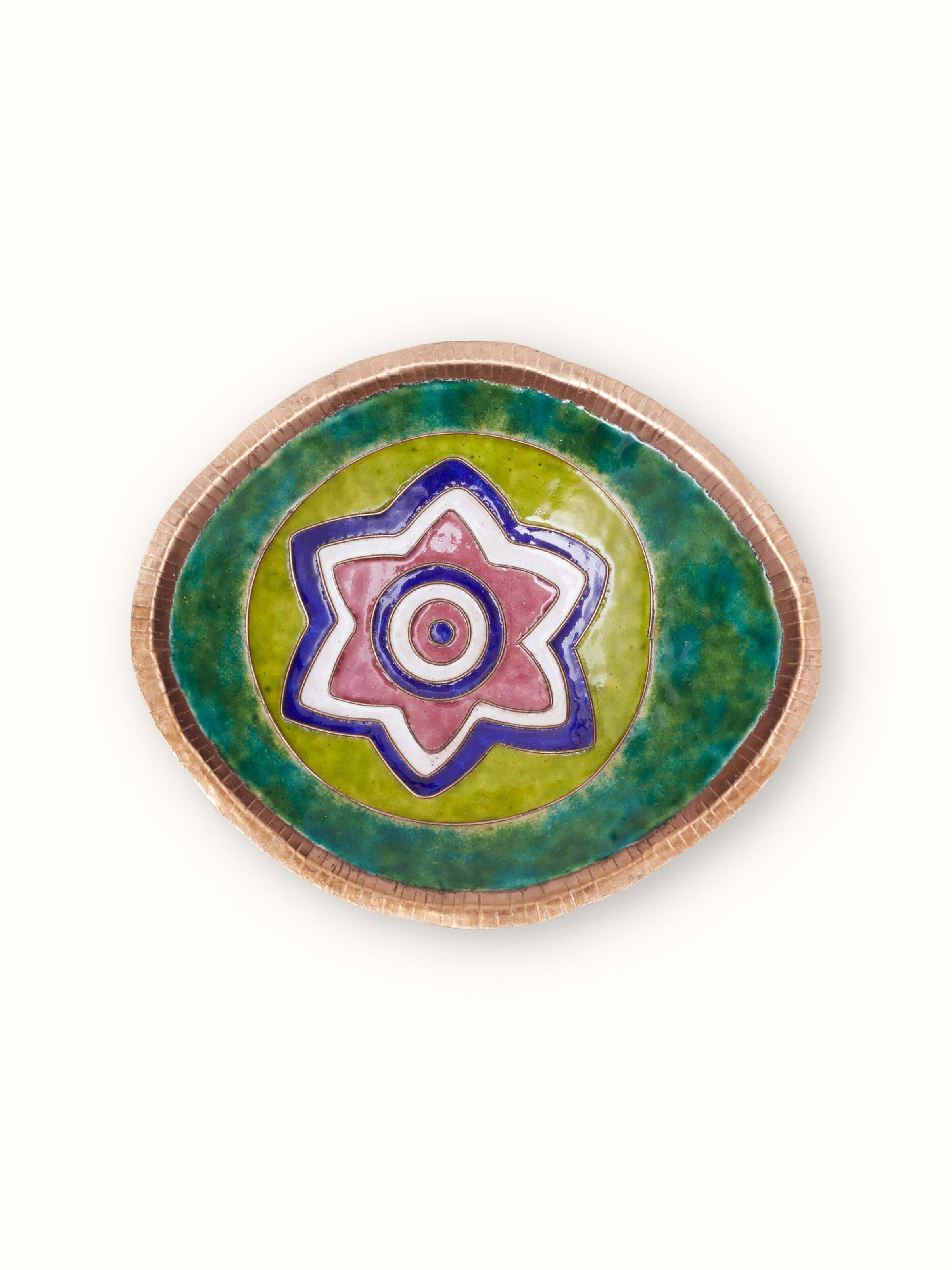 Detailed view of copper nut bowl showing intricate design