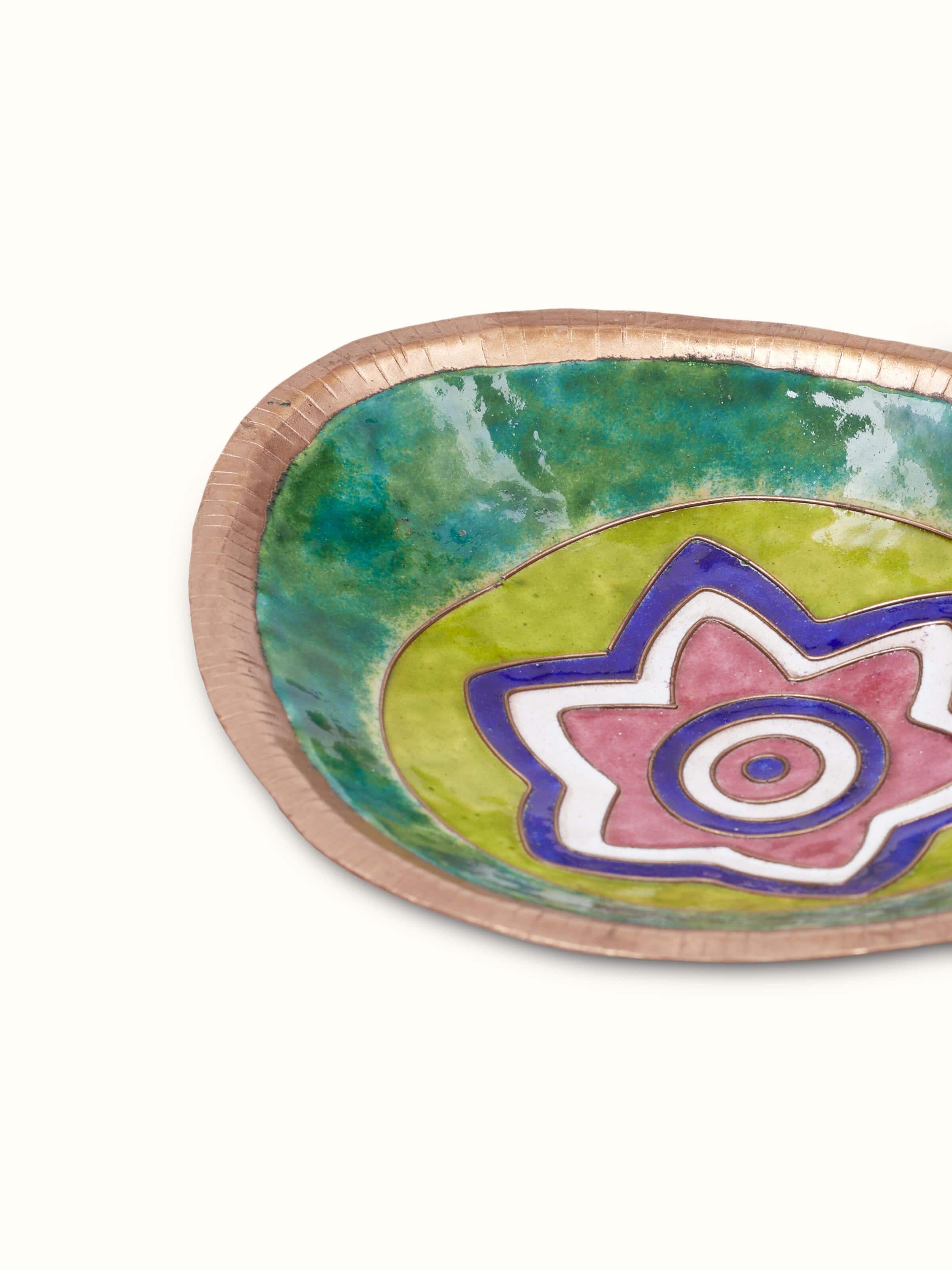 Close-up of copper nut bowl with reflective surface