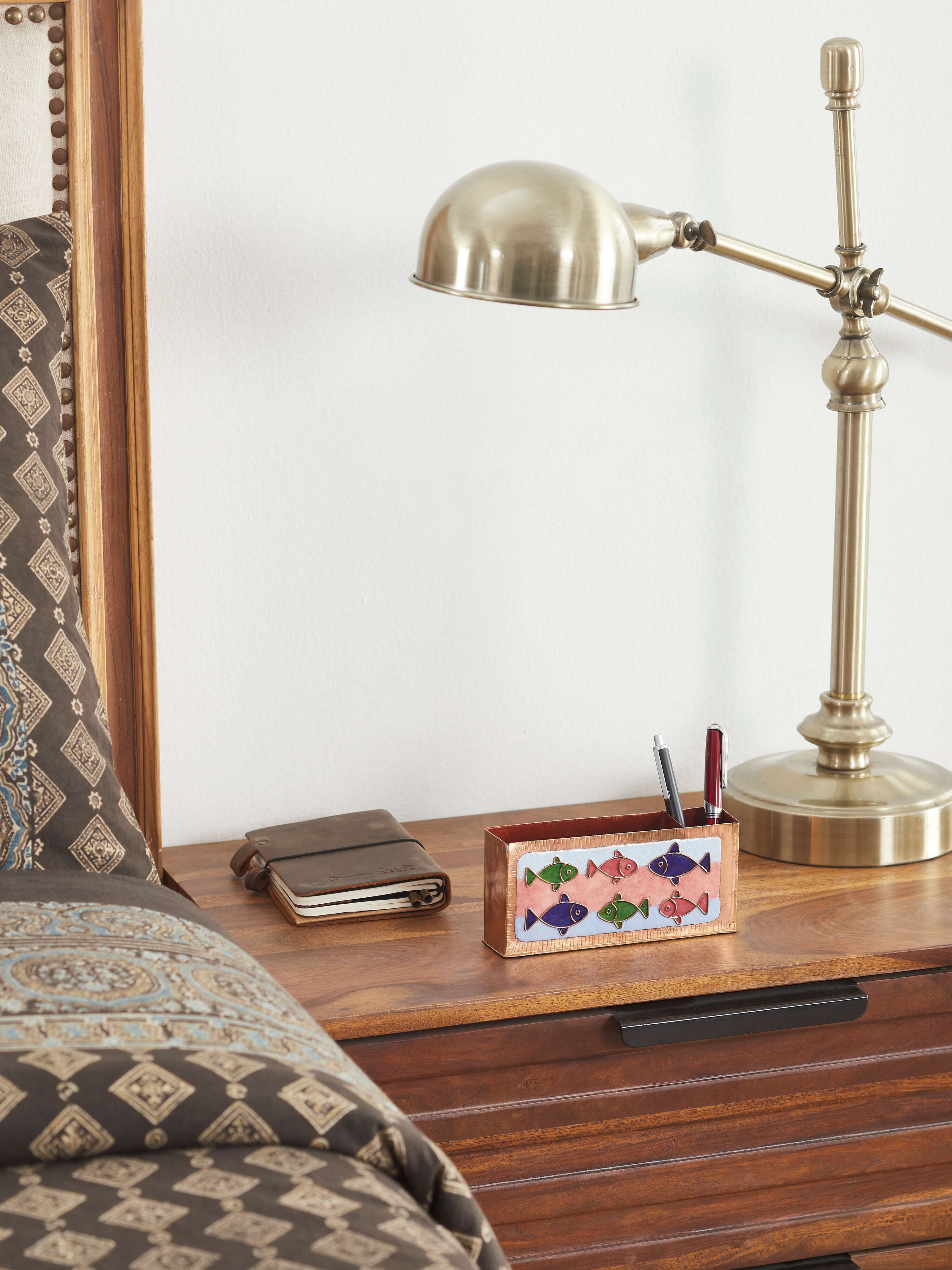 Side view of Copper Fish Motif Pen Holder, showcasing the detailed fish motifs and the elegant copper craftsmanship.