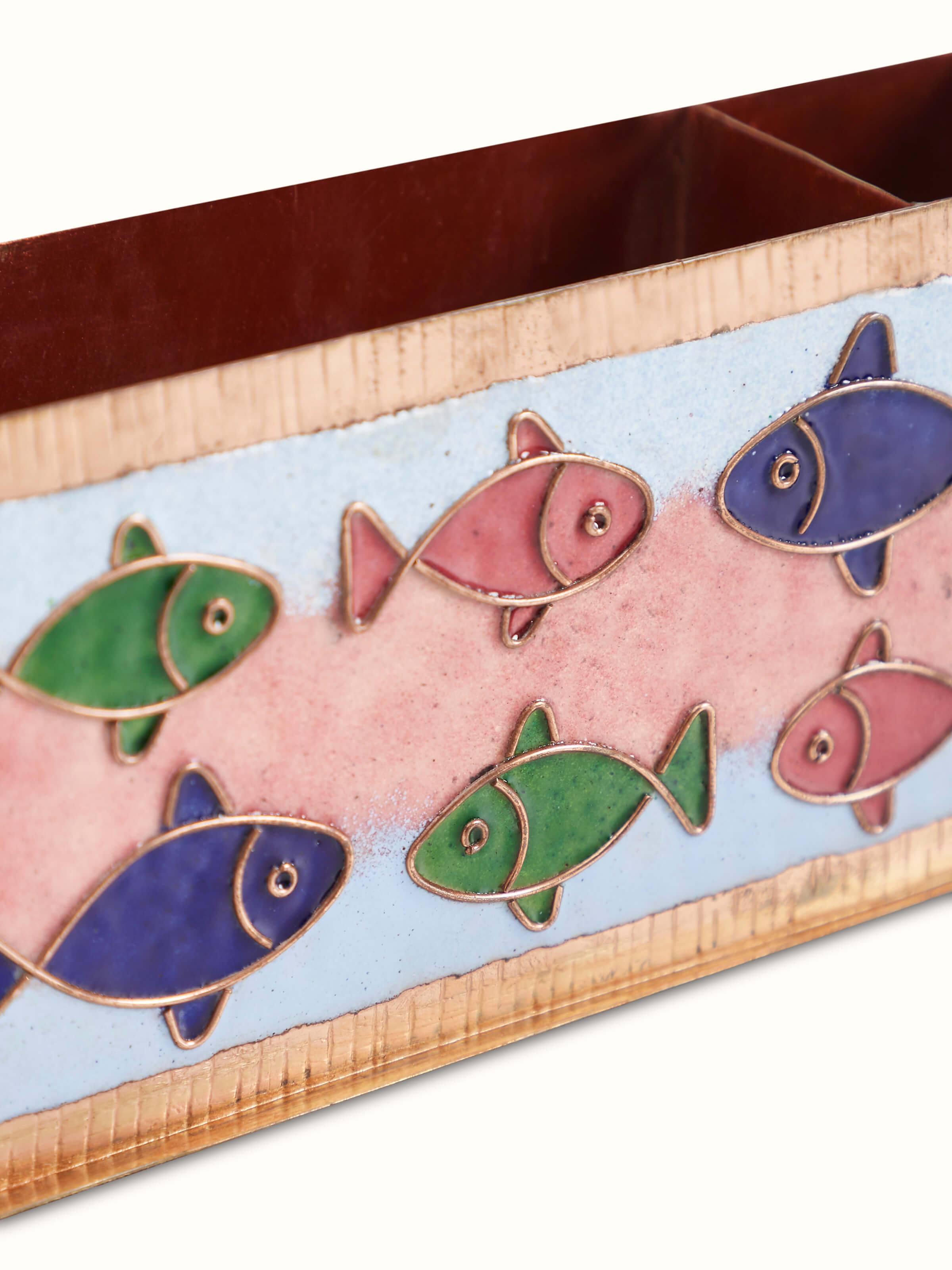 Detailed view of Copper Fish Motif Pen Holder, highlighting the detailed fish design and polished surface of the copper.