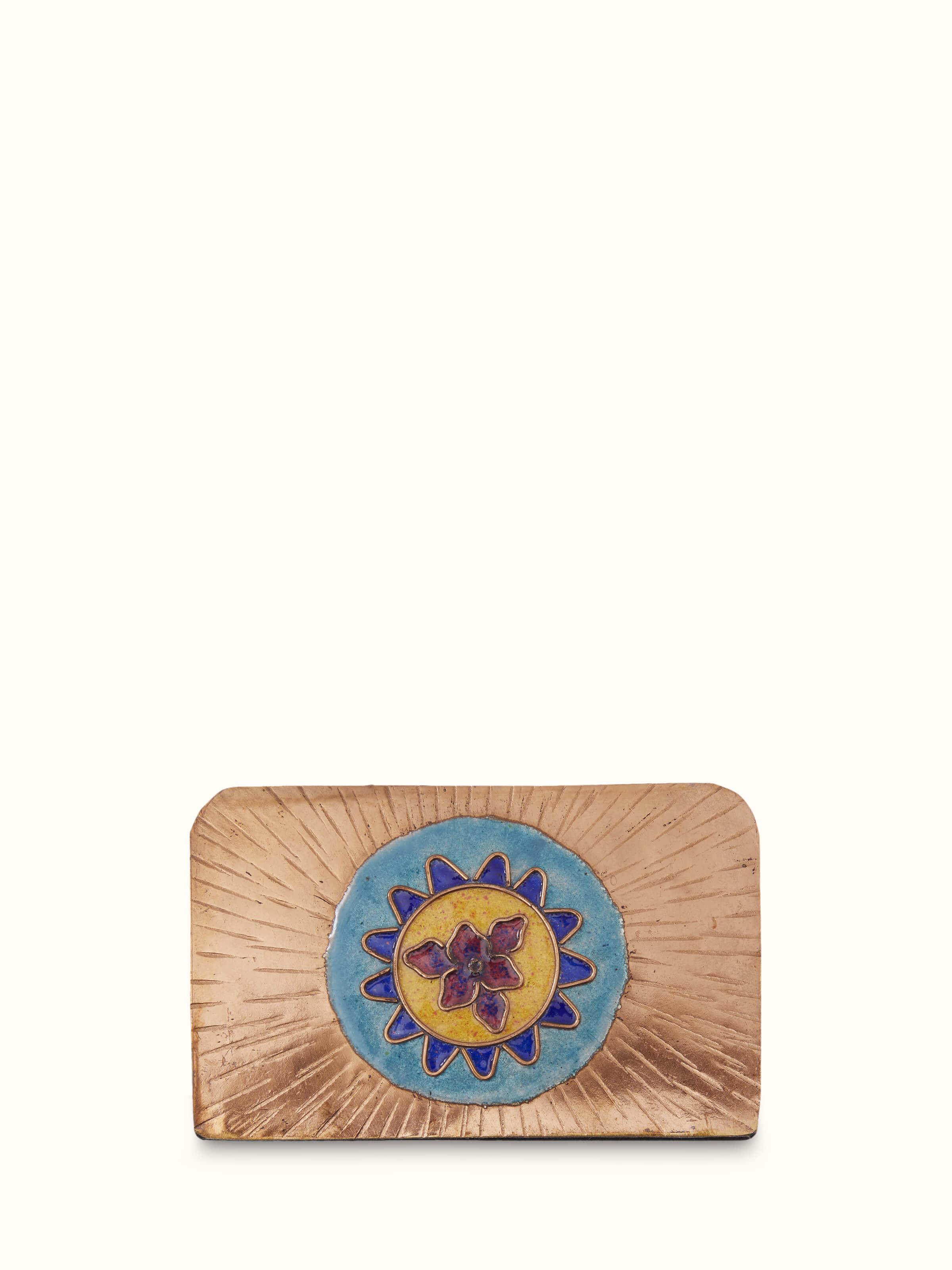 Close-up view of copper sunshine square card holder in blue, showcasing the intricate pattern