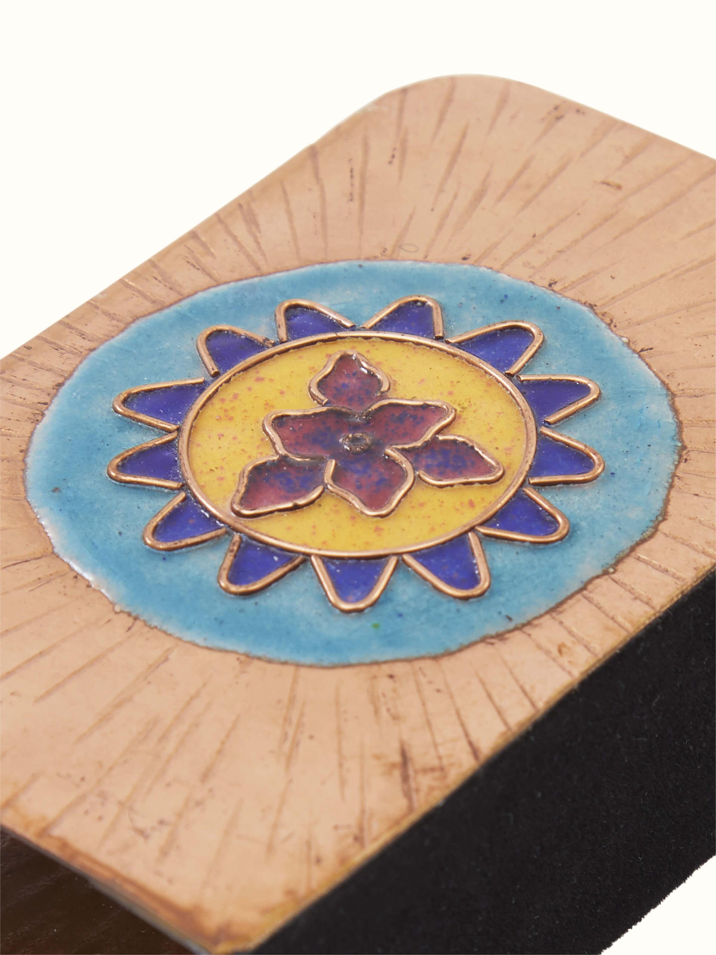 Angled view of copper sunshine square card holder in blue, highlighting its elegant design