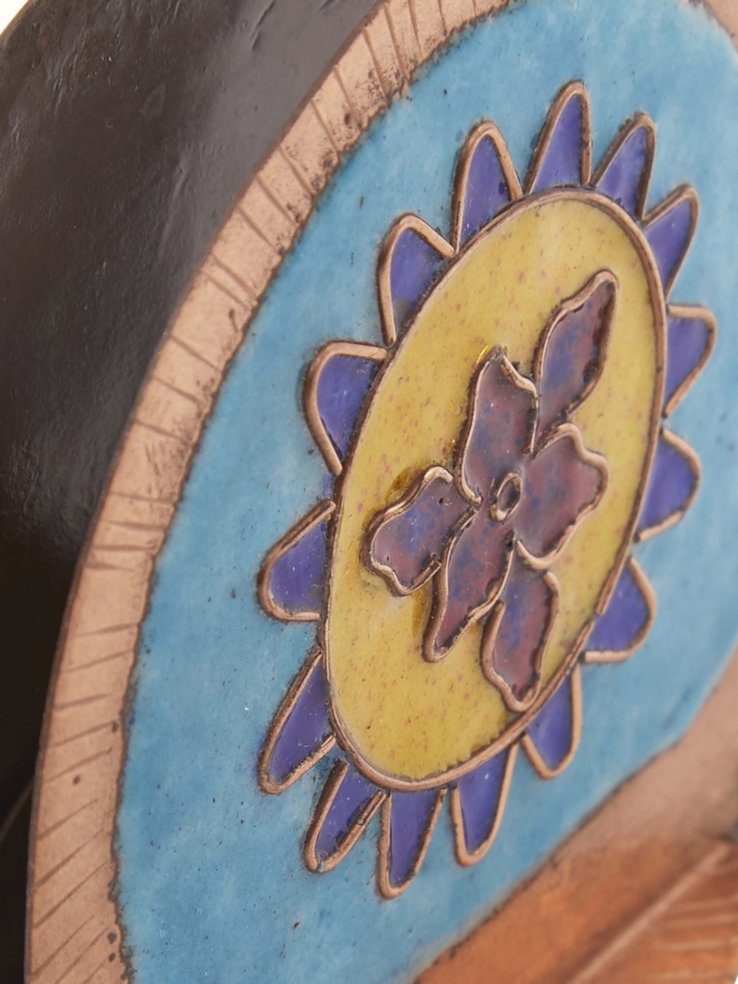 Close-up view of Copper sunshine round card holder blue, emphasizing its intricate details and sheen.