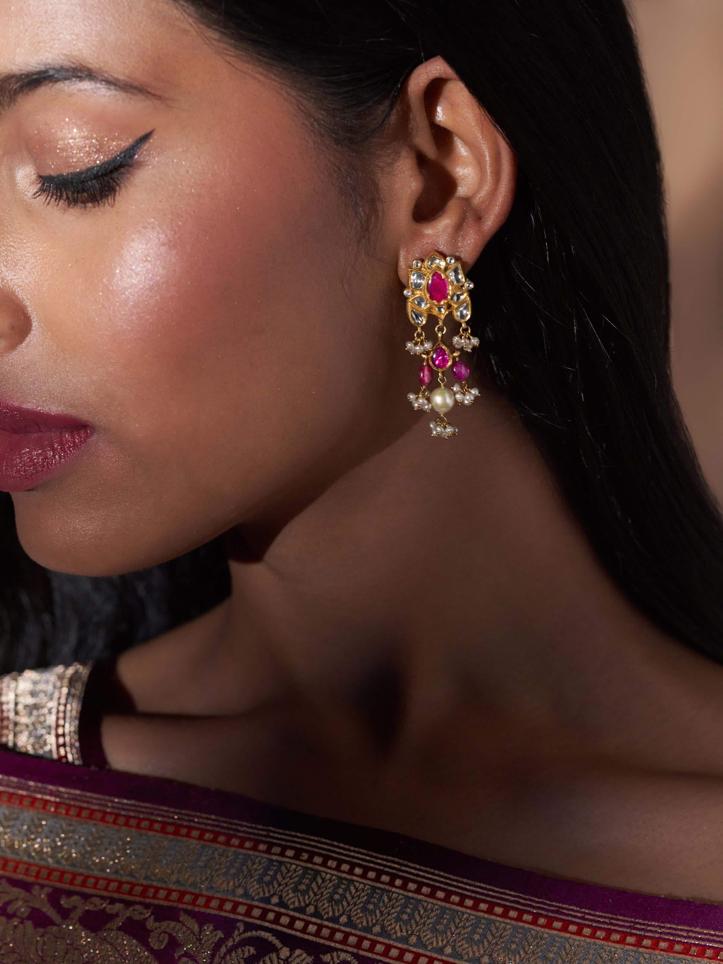 Close-up of Jadau 18 Karat Gold Drop Earrings, emphasizing details