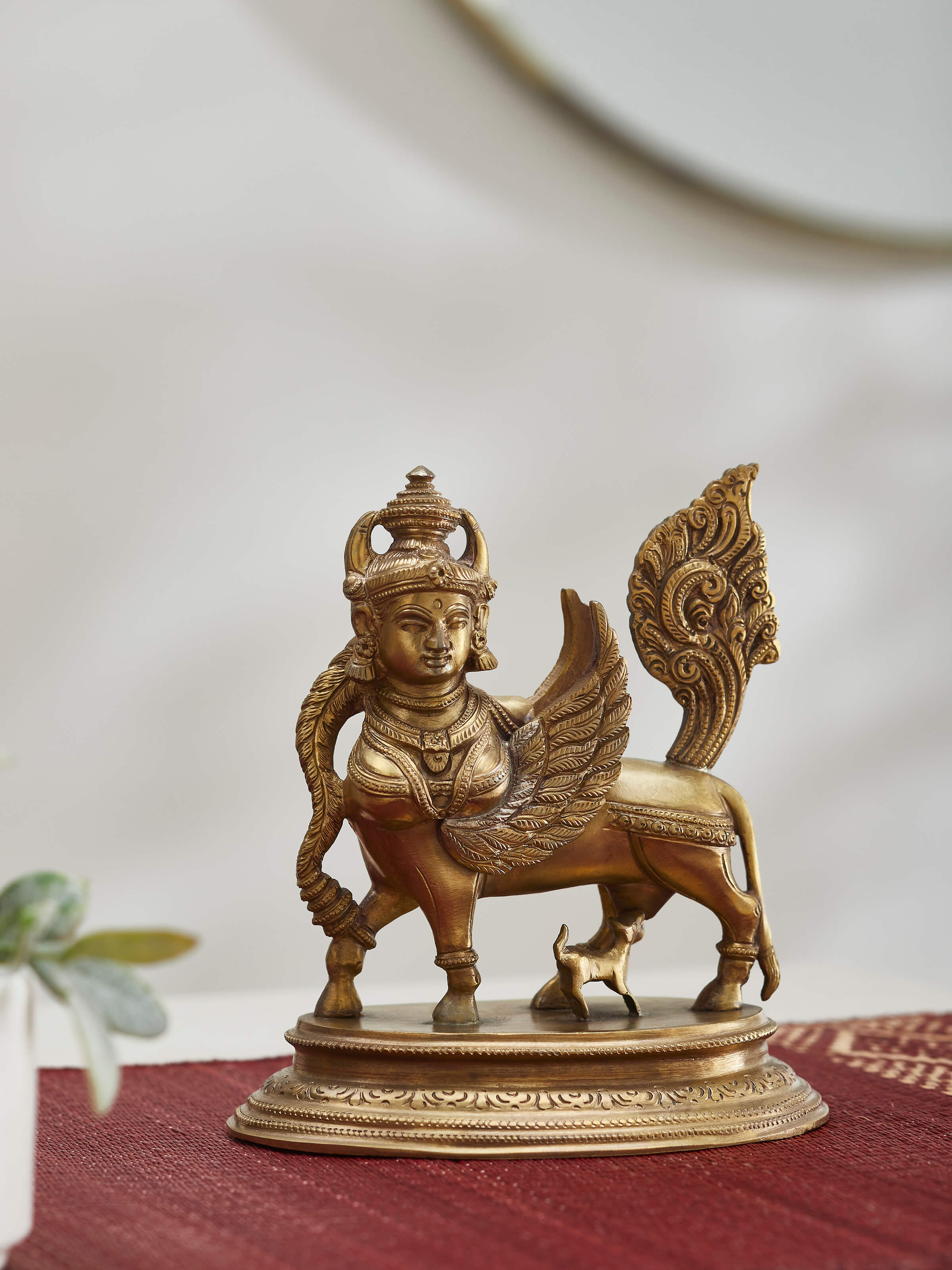 Side view of Kamadhenu bronze casting idol highlighting artistic features