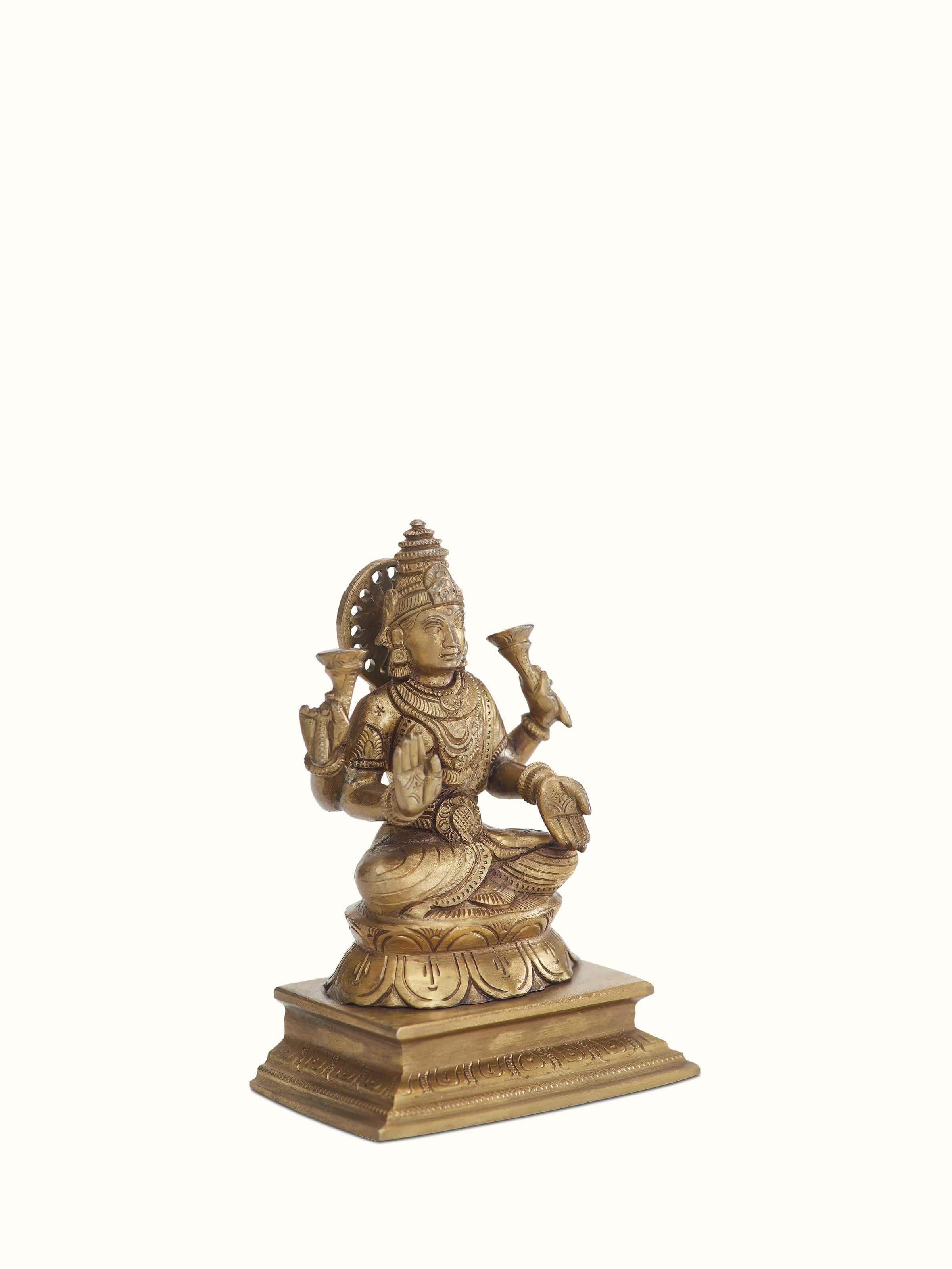 Angled view of Lakshmi bronze casting idol emphasizing the intricate details and traditional bronze casting