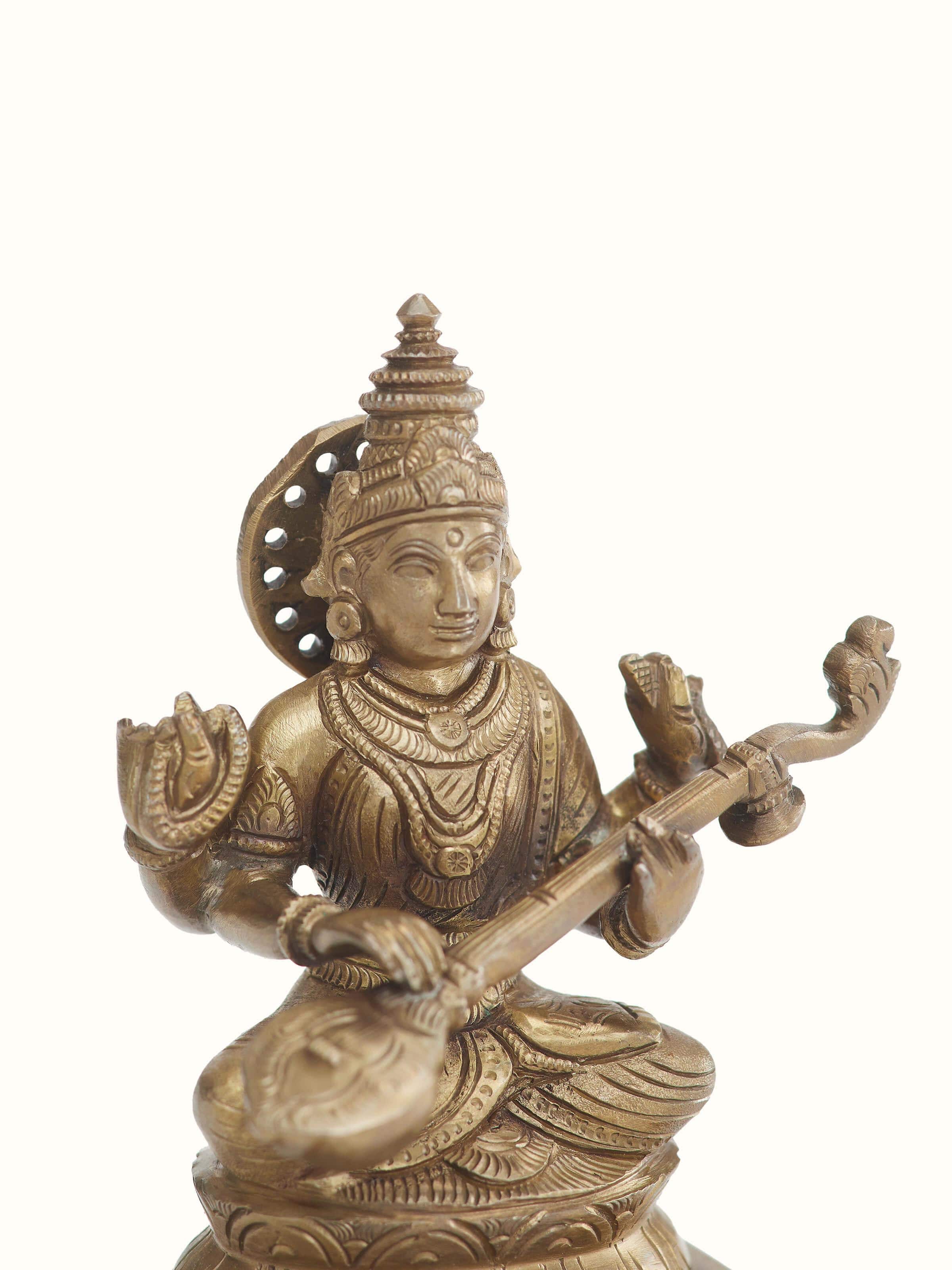 Side view of Saraswathi bronze casting idol showcasing the detailed bronze work and traditional features