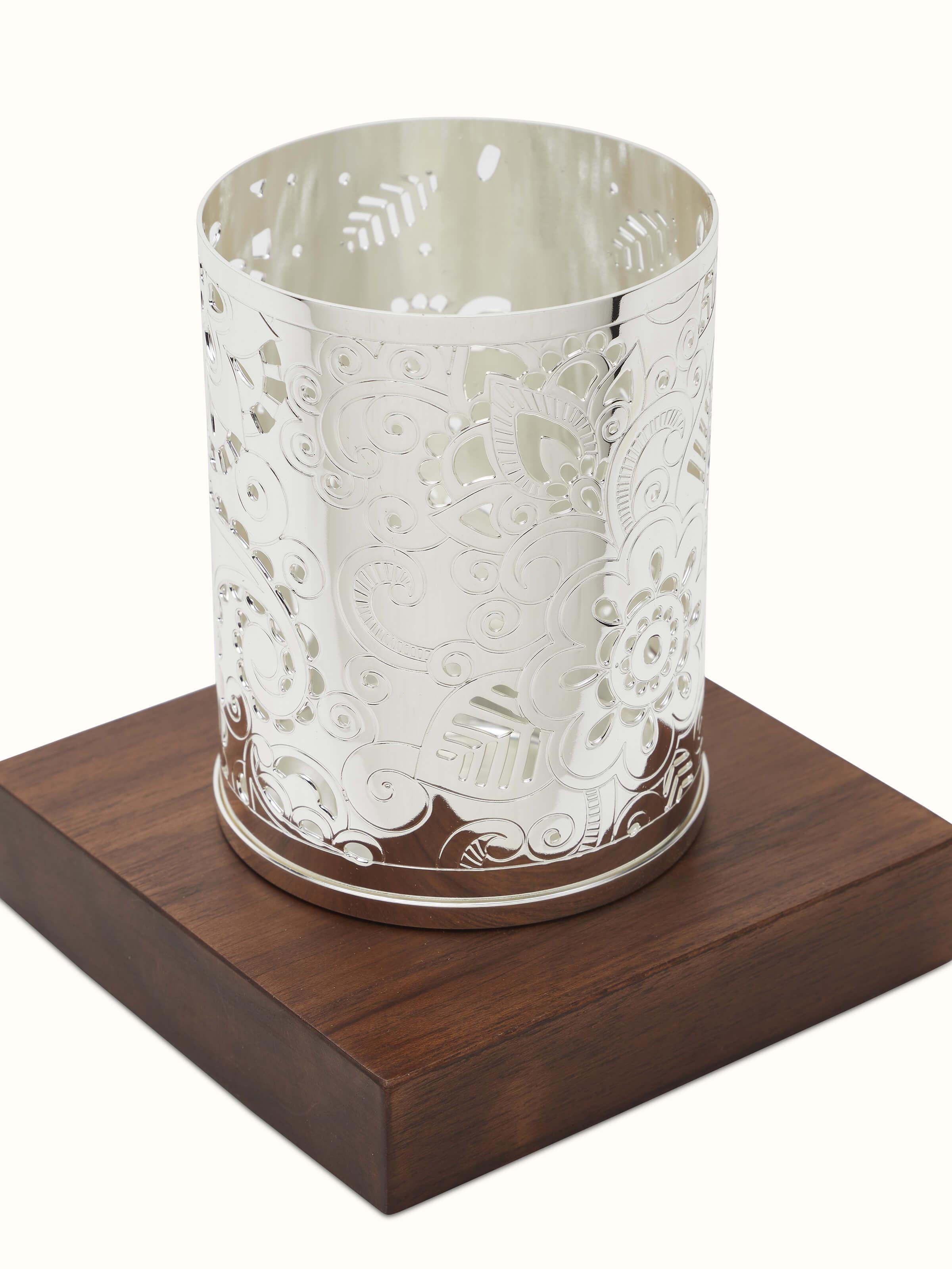 Close-up of Silver-Plated Round Paisley Tea Light Holder showing reflective surface.