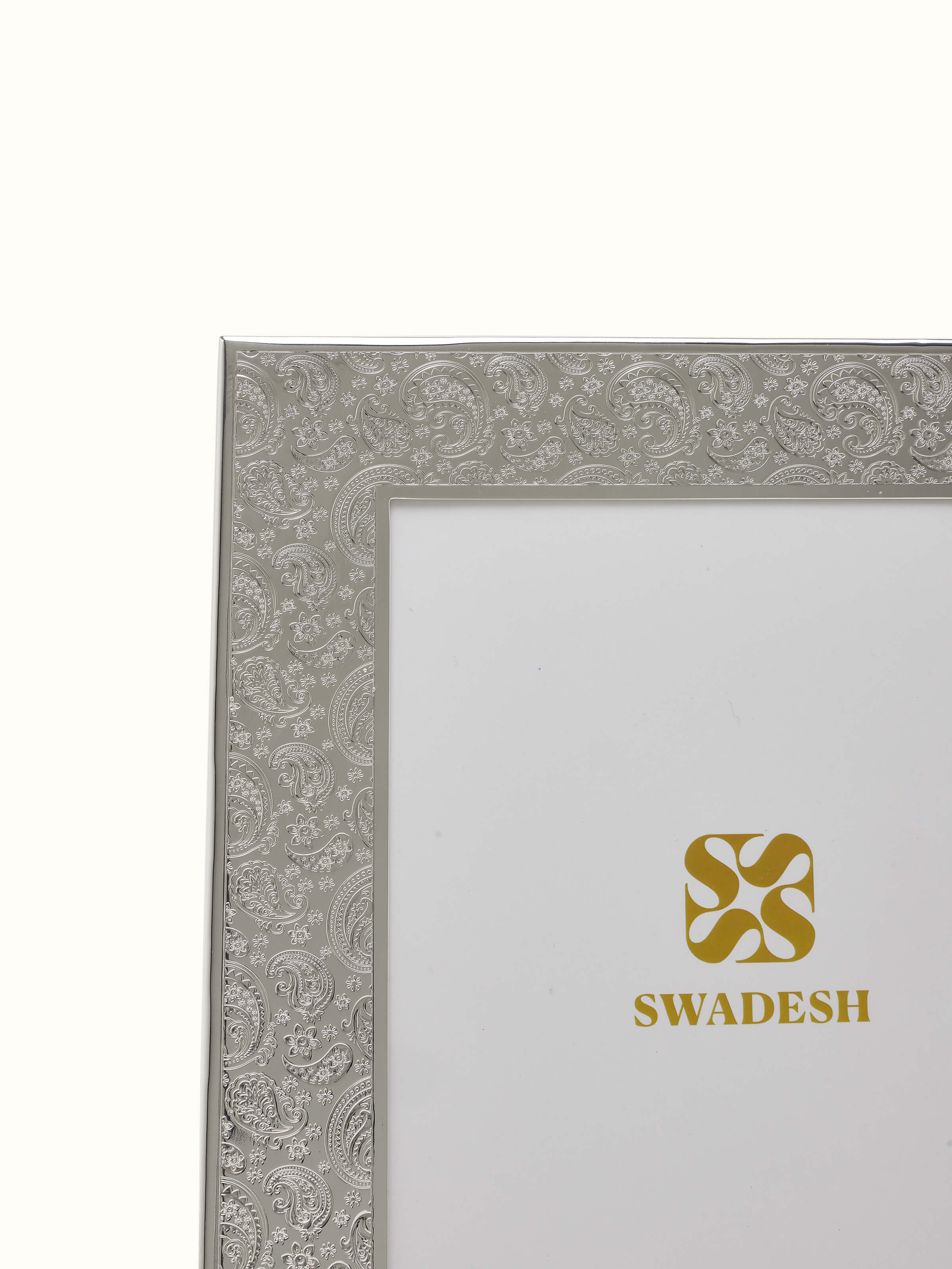Close-up view of silver-plated paisley rectangular photo frame (15 x 13 inches) displaying intricate paisley patterns